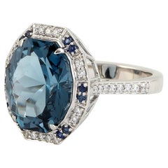 Barrel cut London Blue Topaz Ring Accented With Diamonds Made In 18k White Gold