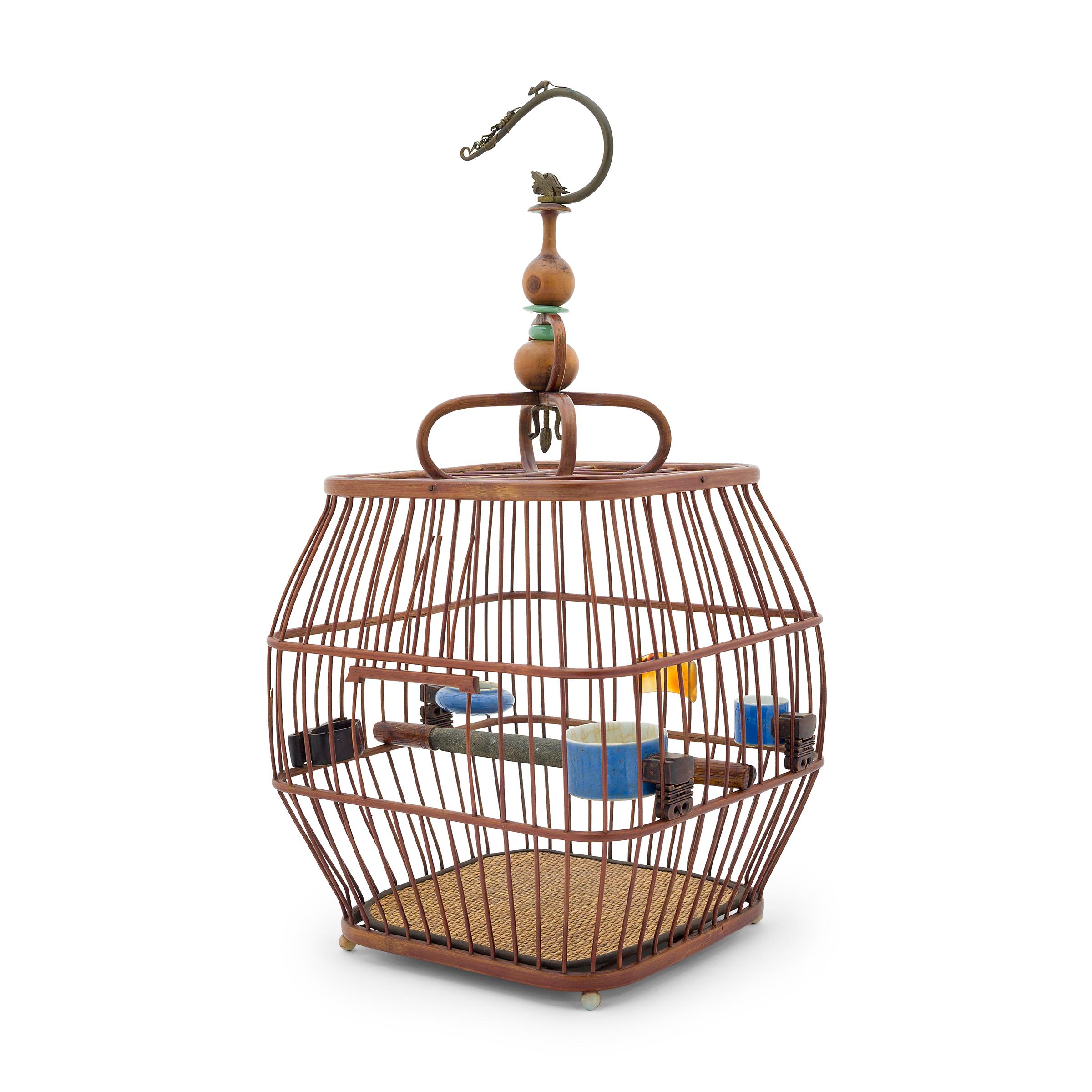 This charming, barrel-form birdcage was once home to the pet songbird of a Qing-dynasty aristocrat. Bird-keeping was a popular pastime throughout the Qing dynasty and inspired its own material culture of beautiful cages and fine accessories. Dated