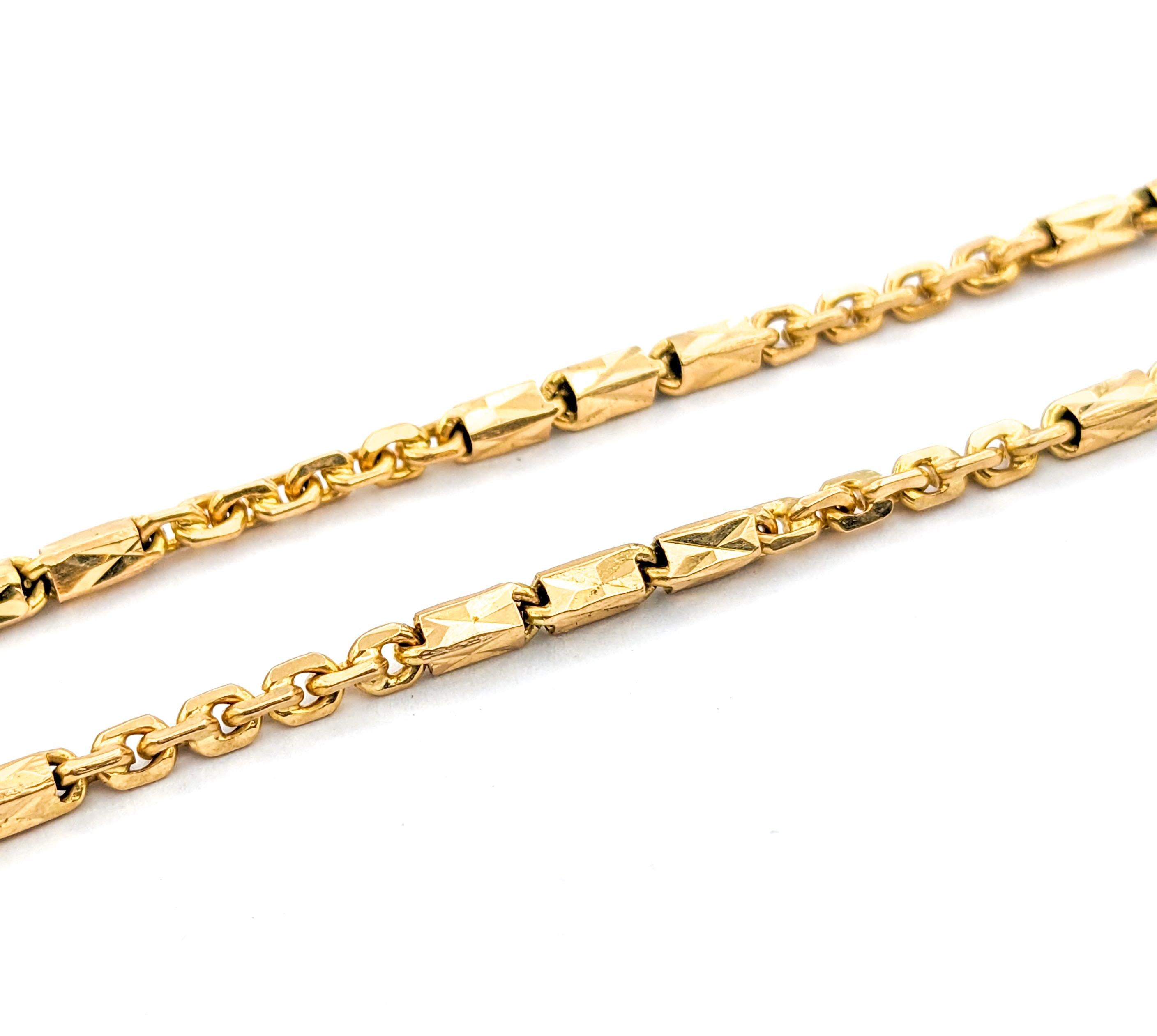 Barrel link design Necklace In Yellow Gold

This exquisite gold fashion necklace, beautifully crafted in 18kt yellow gold, showcases an elegant chain & barrel link design. With a generous length of 28 inches and a width of 2.2mm, this necklace