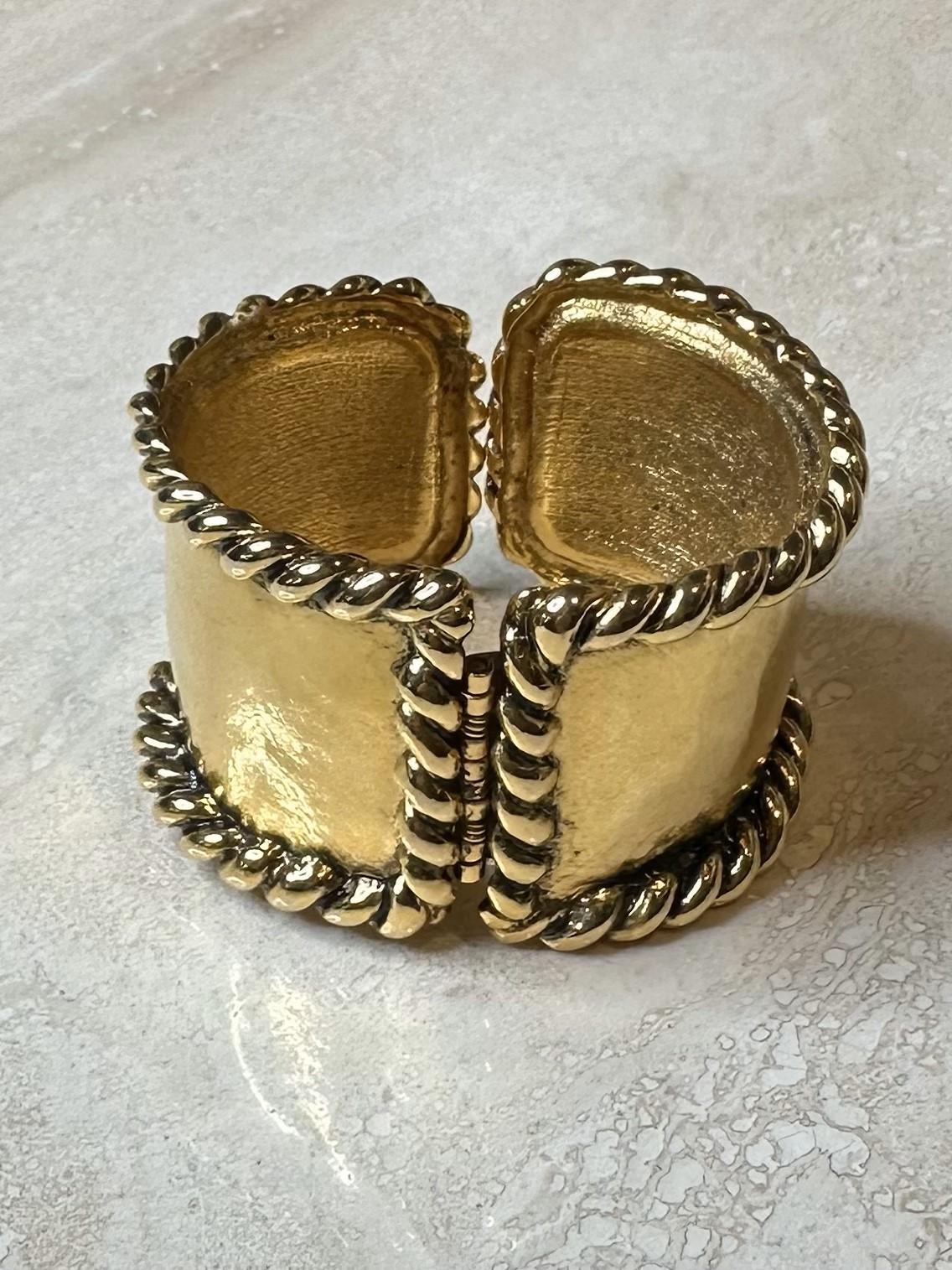The Barrera Gold Rope Cuff is a timeless, elegant piece that combines a classic gold-plated finish with a distinctive rope texture. This cuff is a versatile accessory that can be worn with both formal and casual outfits, making it suitable for a