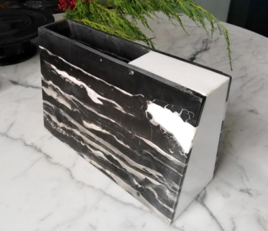 An obstruction to protect. To maintain. To weigh in. To remind.
A hand-crafted objet d’ art that calls attention to the gilded veins in the Port Black Marble from China and the serene White Thasos Marble from Greece. Complemented superbly by its