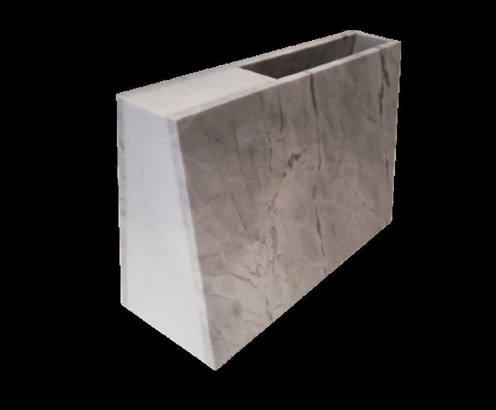 An obstruction to protect. To maintain. To weigh in. To remind.
A hand-crafted objet d’ art that calls attention to the gilded veins in the Silver Grey Marble and the serene White Thasos Marble from Greece. Complemented superbly by its more