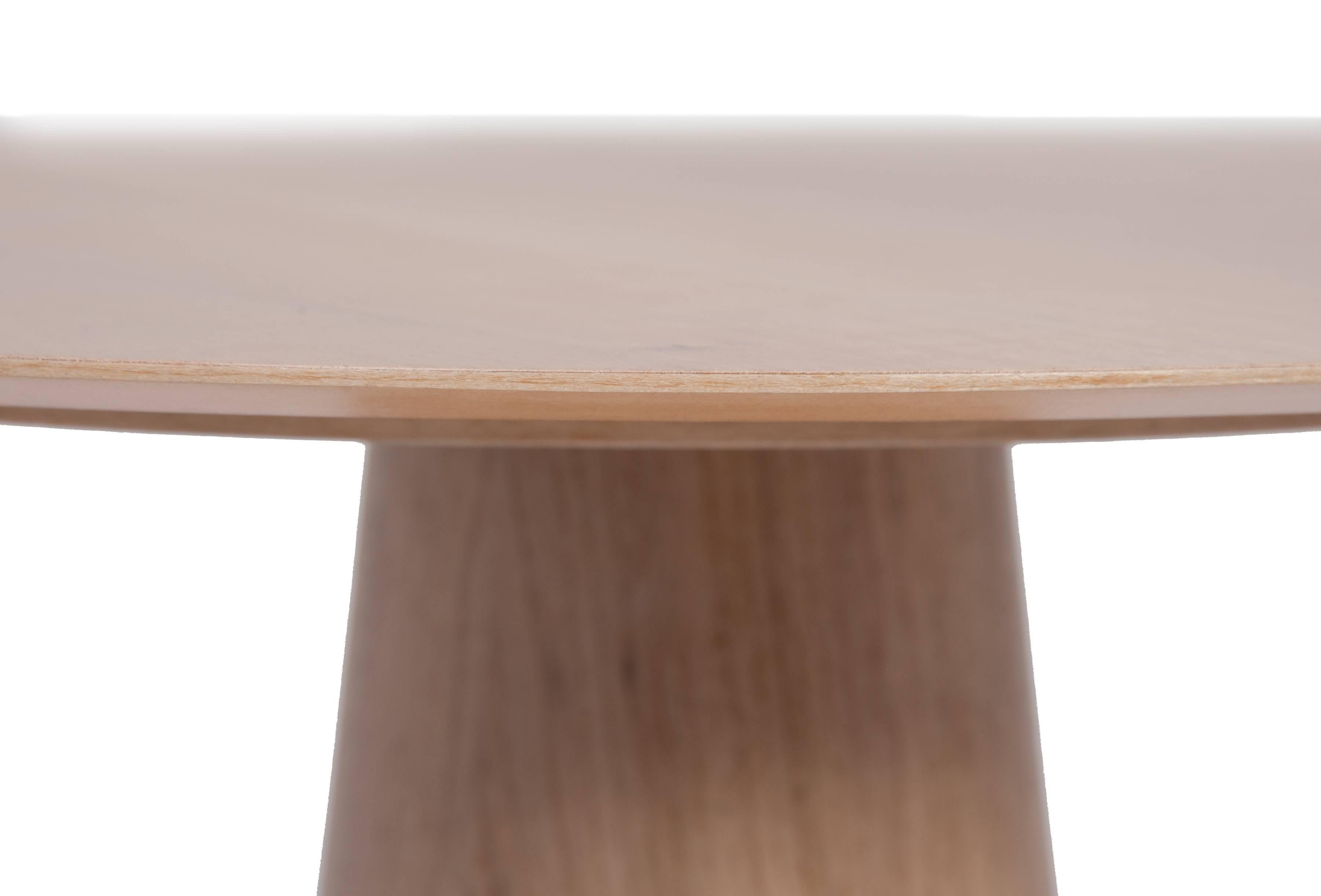 The dialogue between two materials and two different constructive methods happens to define the monolithic geometry of this table base that sometimes reveals transparency and brightness, sometimes opacity and the richness of the wooden surface.