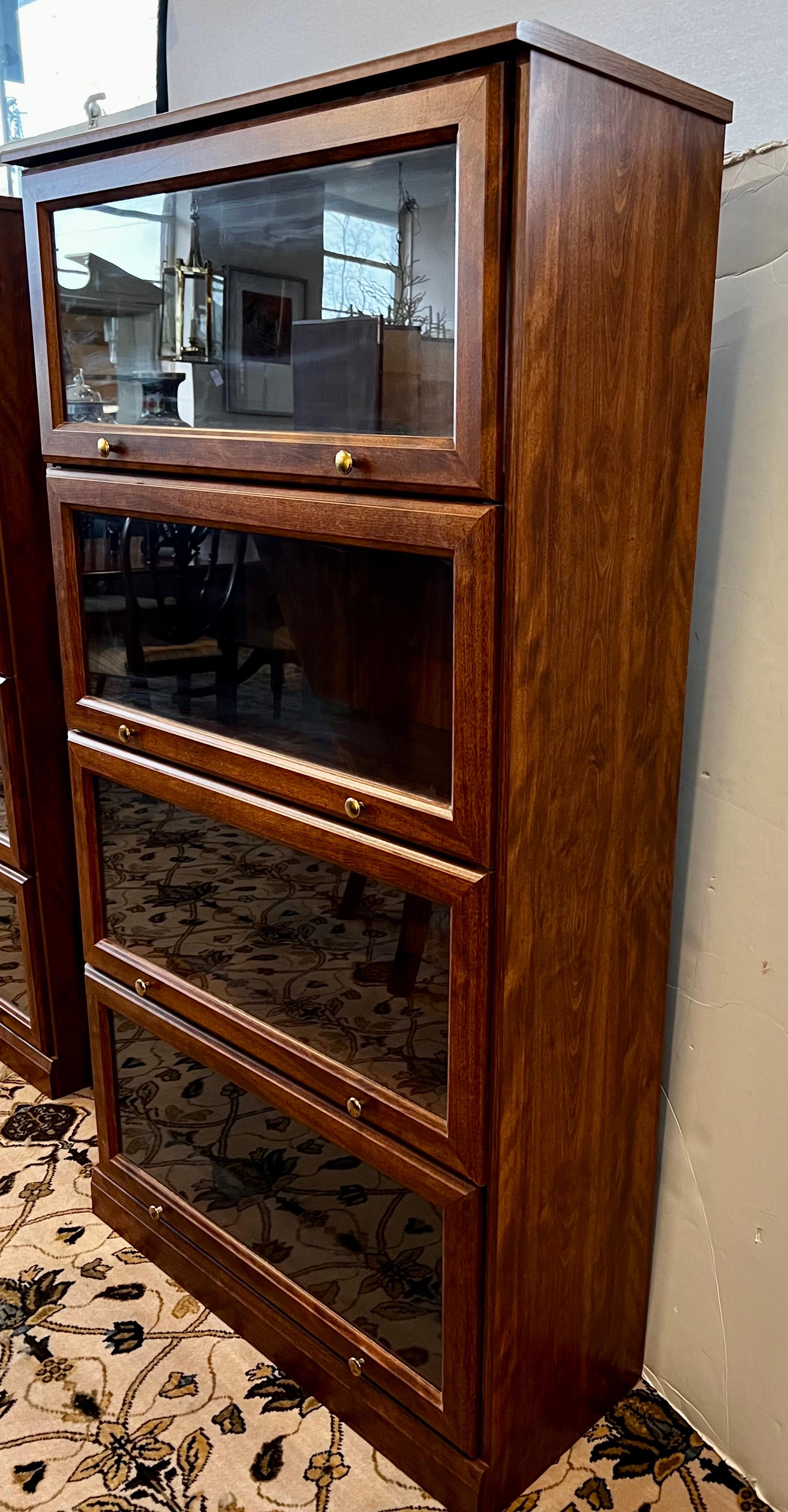 Tall barrister bookcase with glass doors that pull up and can be pushed inside like a true Lawyers/Barrister bookcase.  Does not come apart in sections like some of the older ones do.  One of two we have left.