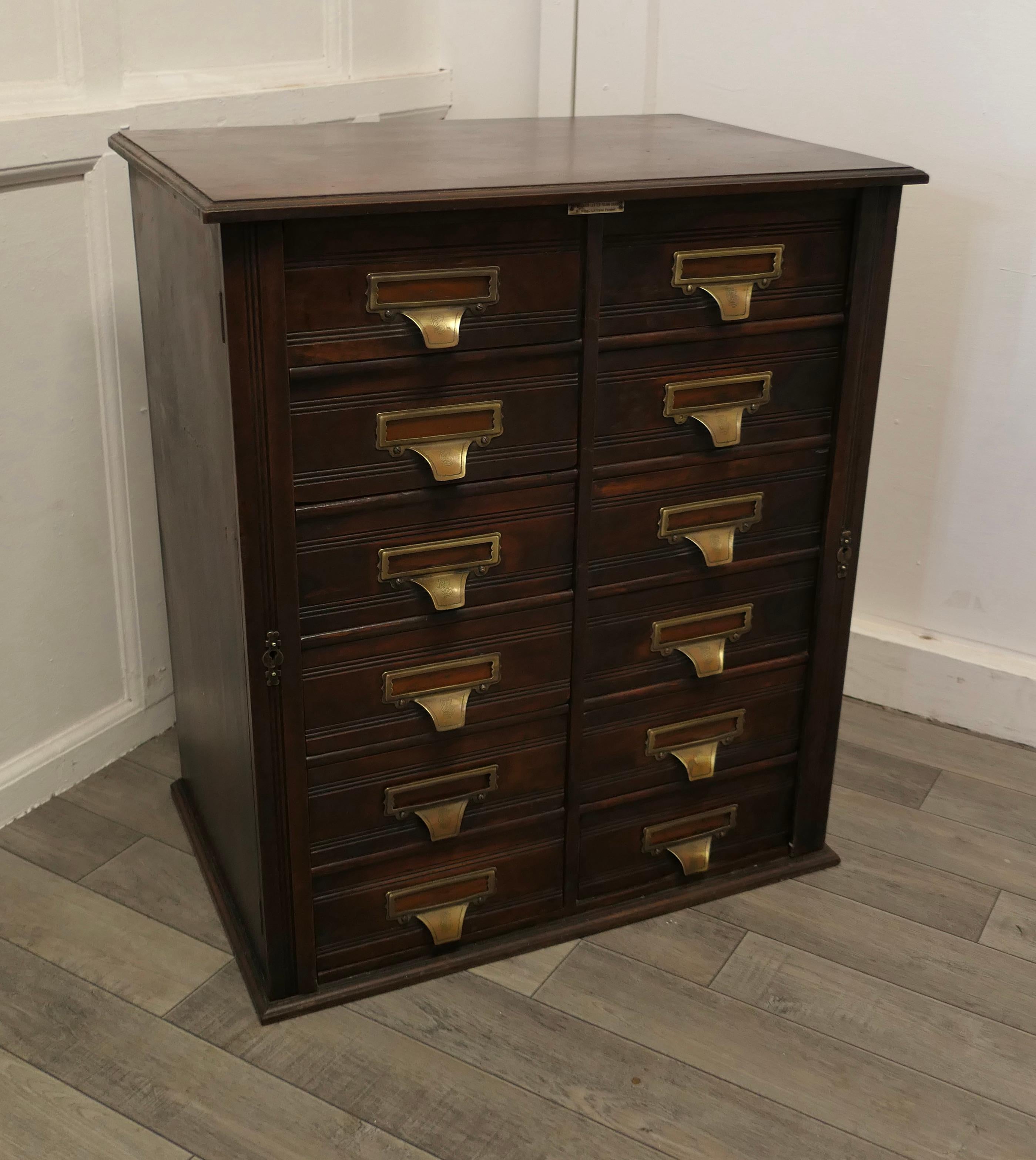 Barristers Wellington filing cabinet by Shannon.

This unusual filing cabinet is made by Shannon, recognised for the quality of their filing systems, the cabinet has 12 drop file drawers, and locking flaps at each side, these have locks but we do