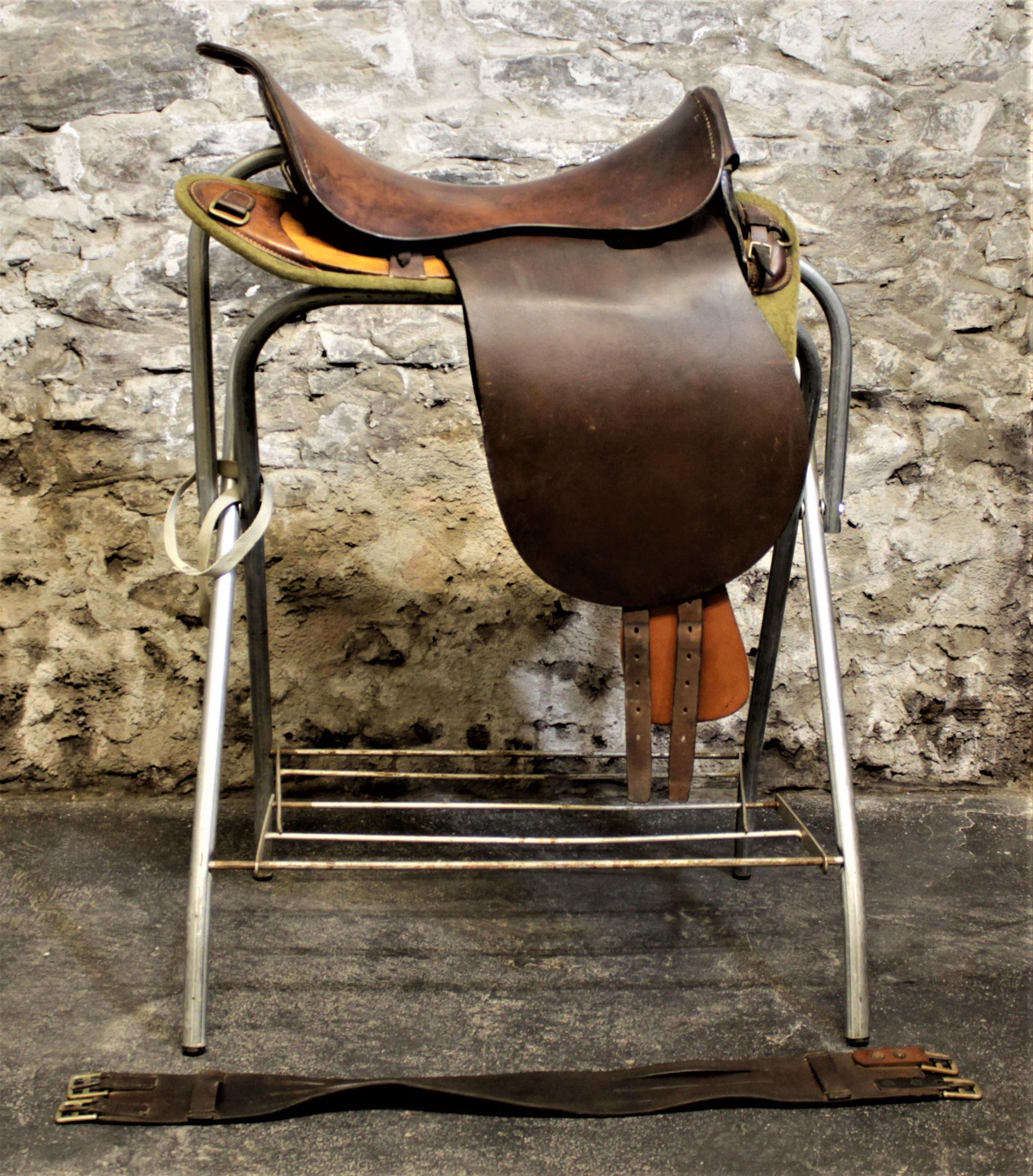 Made for the British military in 1926 by the highly renowned English leather goods maker, Barrow, Hepburn & Gale, this leather horse saddle is done in the Universal Pattern or U.P. style. The saddle has a wooden tree with steel supports, and the