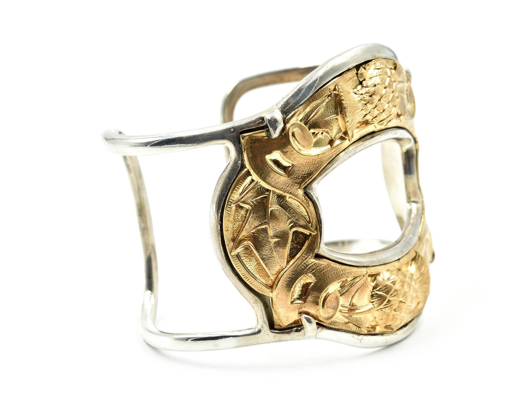 Designer: Barry Brinker
Material: sterling silver and gold vermeil
Dimensions: bangle will fit up to 7.75-inch wrist and the bangle is 2 ½ inches wide
Weight: 86.00 grams
