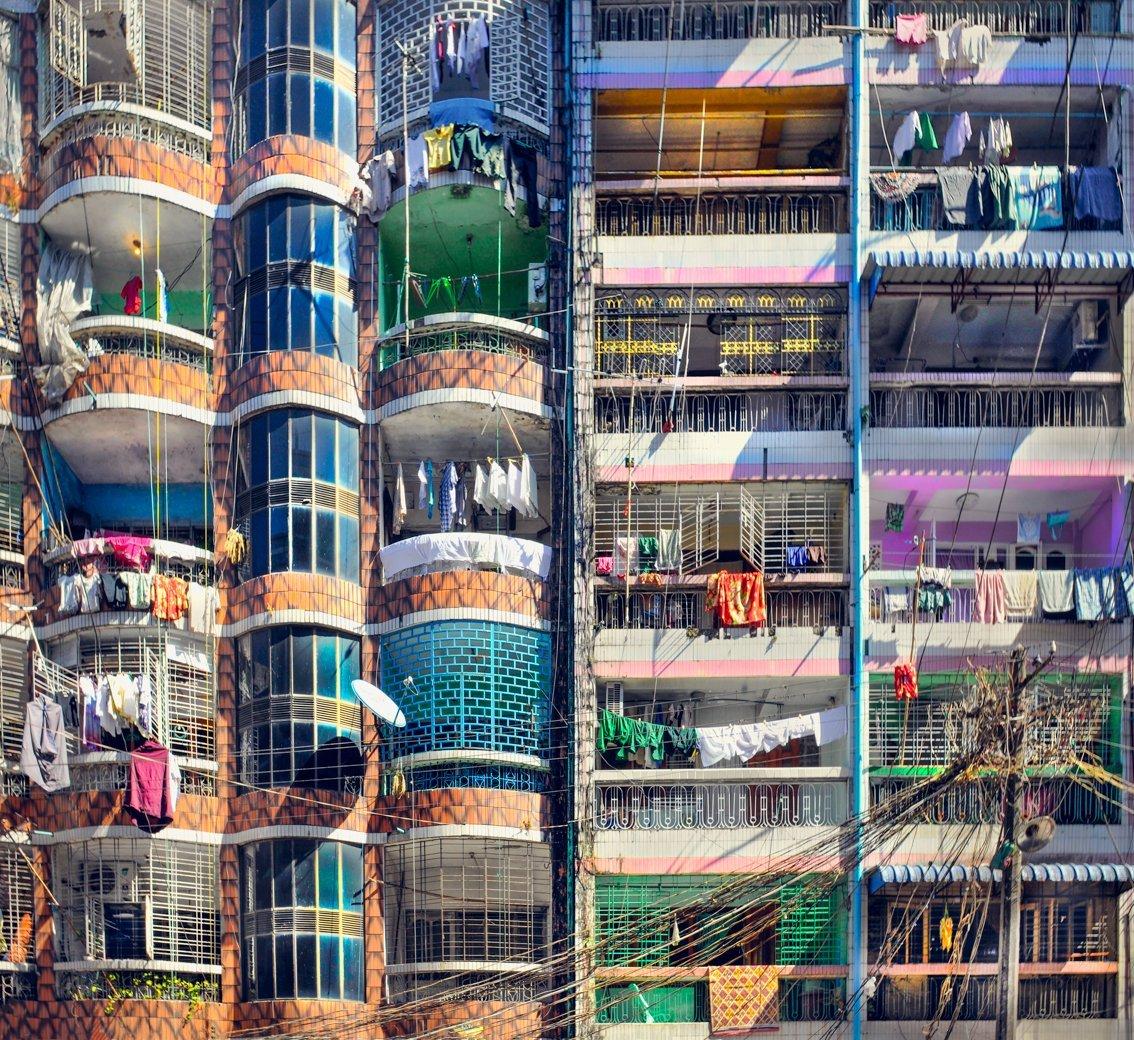 Dynamic  shapes and colours seem almost otherwordly. Yangon, Burma
–
High-rise communal living was once seen as a great step forward for mankind.  Cawston’s Tenement series captures the individual within the collective.  By focusing on the