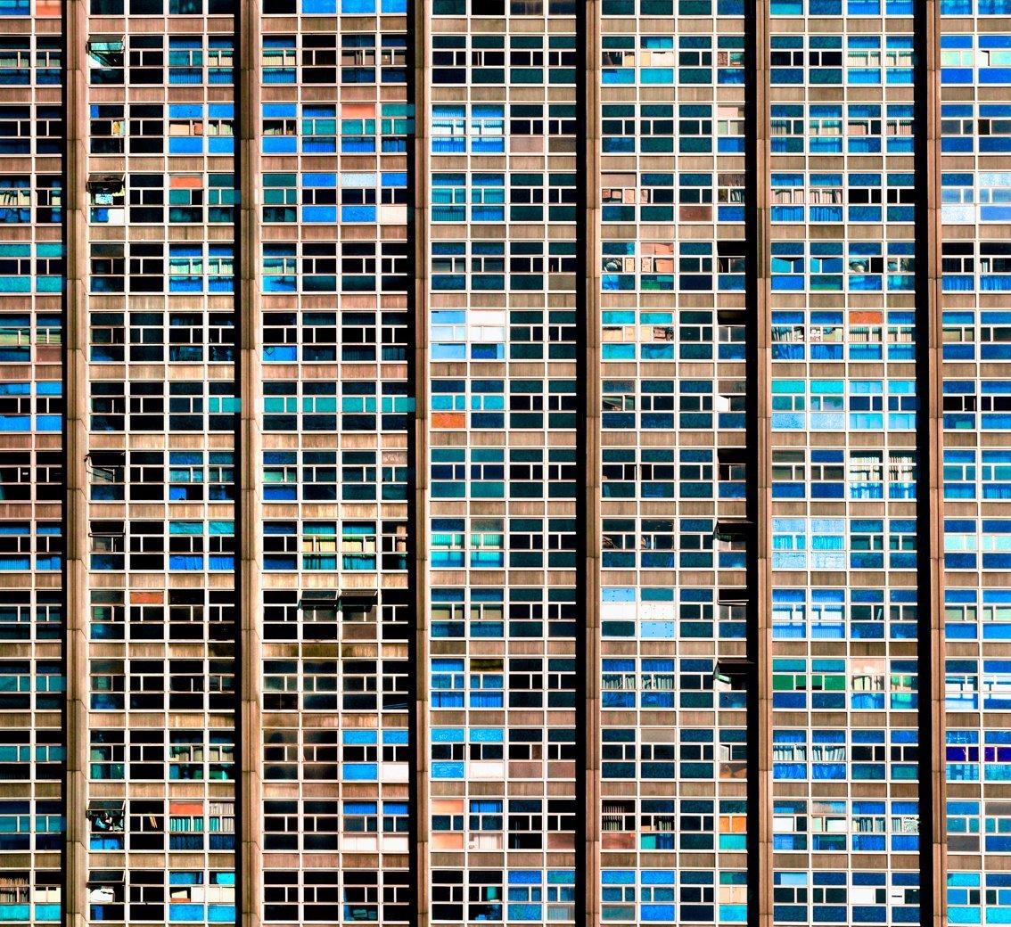 The abstraction of modern living in 65 flats in Rio de Janeiro
–
High-rise communal living was once seen as a great step forward for mankind.  Cawston’s Tenement series captures the individual within the collective.  By focusing on the repetitive