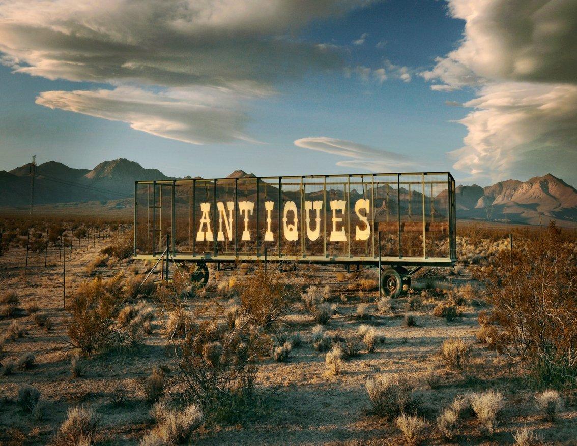 Sunset lights an advertisement for antiques…. seemingly abandoned on a highway in California
–
Cawston’s eye for colour, structure and the beauty of the mundane finds a world-in-waiting as he journeys across the American West.
“The greatest part of