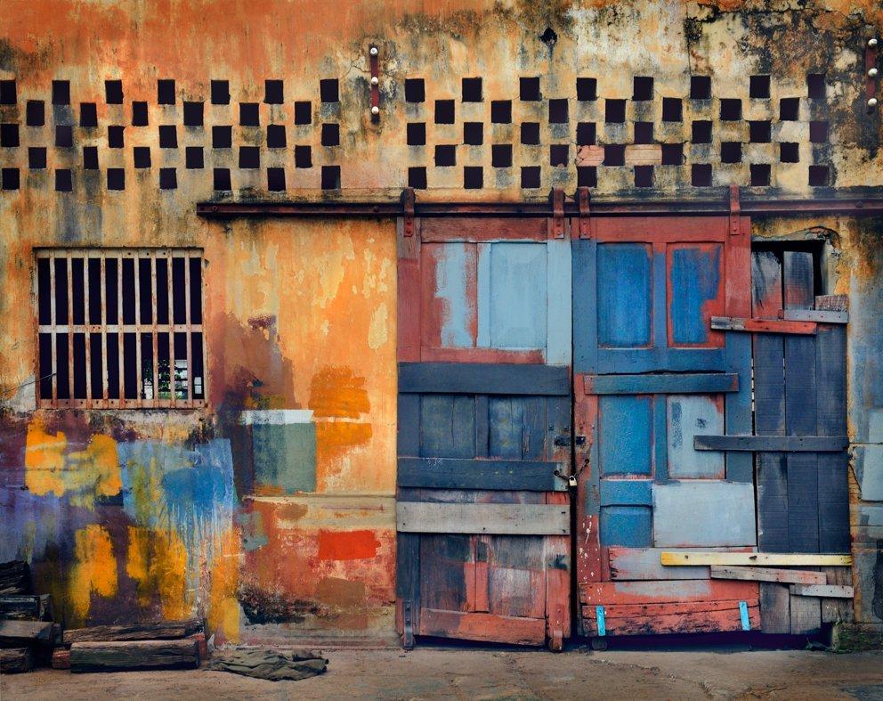 An exuberance of colour in Brazil
–
The Spaces in Between series developed out of visits to Naples in Italy and Havana in Cuba, two cities whose past glories are suffused with a faded grandeur.  Cawston’s search for these lost spaces of distressed