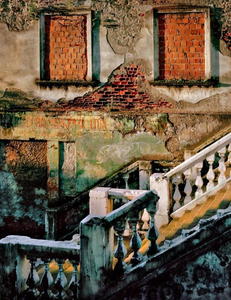 Sunset over a distressed stairway of former grandeur in Salvador
–
The Spaces in Between series developed out of visits to Naples in Italy and Havana in Cuba, two cities whose past glories are suffused with a faded grandeur.  Cawston’s search for