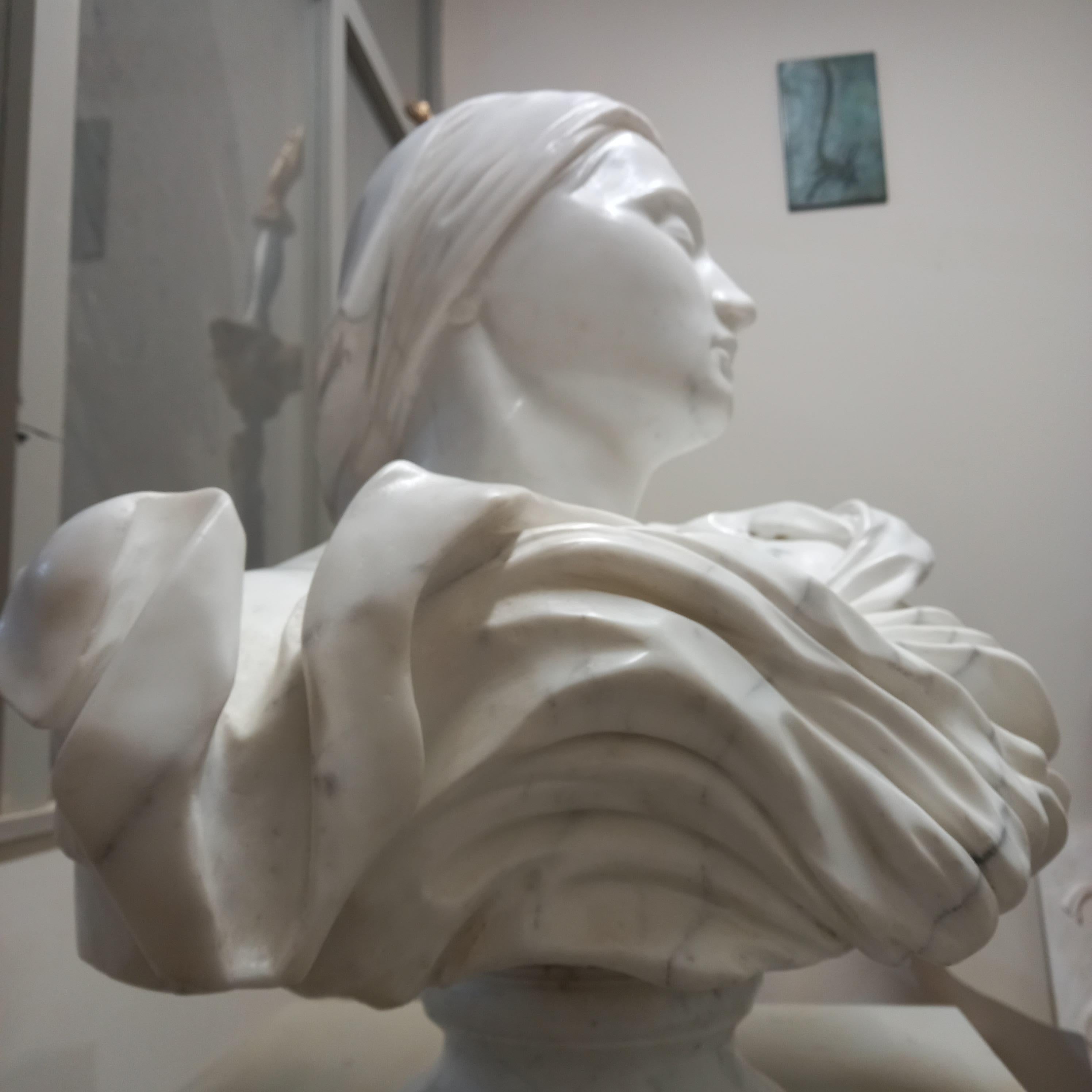 Joan of Arc is depicted here at a solo exhibition in St. Edwards chapel at St. David's Cathedral, South Wales. Hand carved from a solid block of Carrara marble imported from Italy, Davies used traditional tools also used by the master sculptors of