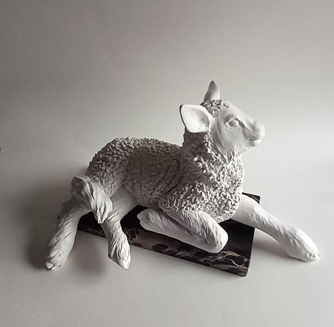 This lamb is also featured in my statue of Saint David. It conveys such character and gentleness that I decided to present it as a sculpture in its own right. I lays on a base of black and gold marble called  Portoro marble from the Gulf of Poets,