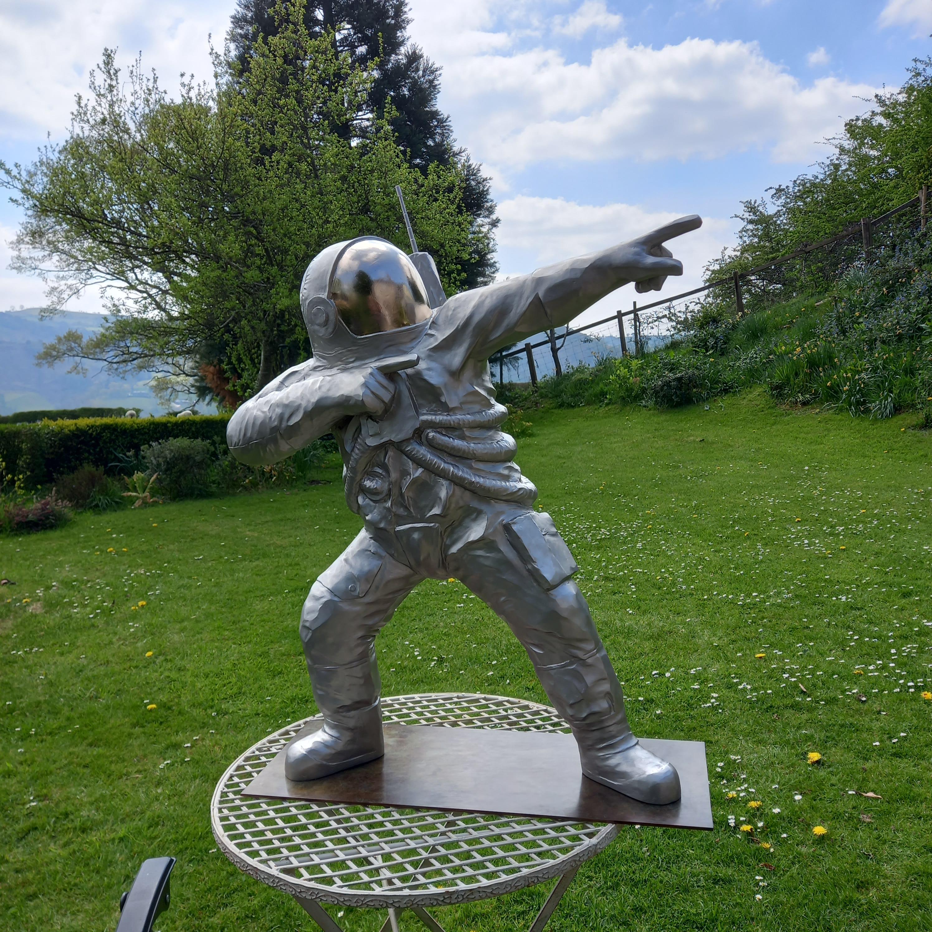 Space Race - Gold Figurative Sculpture by Barry Davies