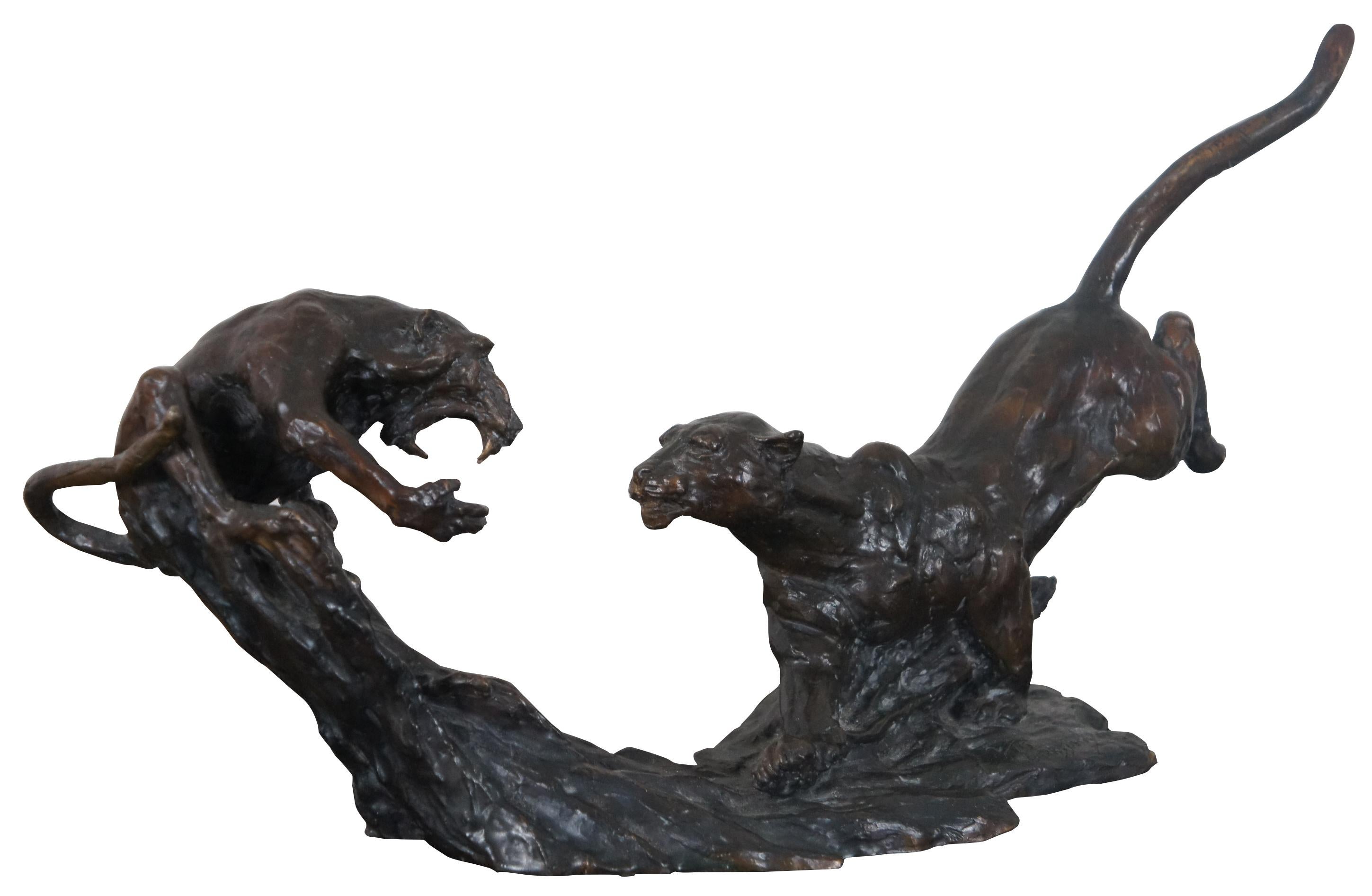 Bronze sculpture featuring a leopard leaping at a screeching baboon on a tree stump. Signed and numbered 2/15. Barry Jackson (Born 1949) is active/lives in South Africa. Barry Jackson is known for sculpture. Measure: 16