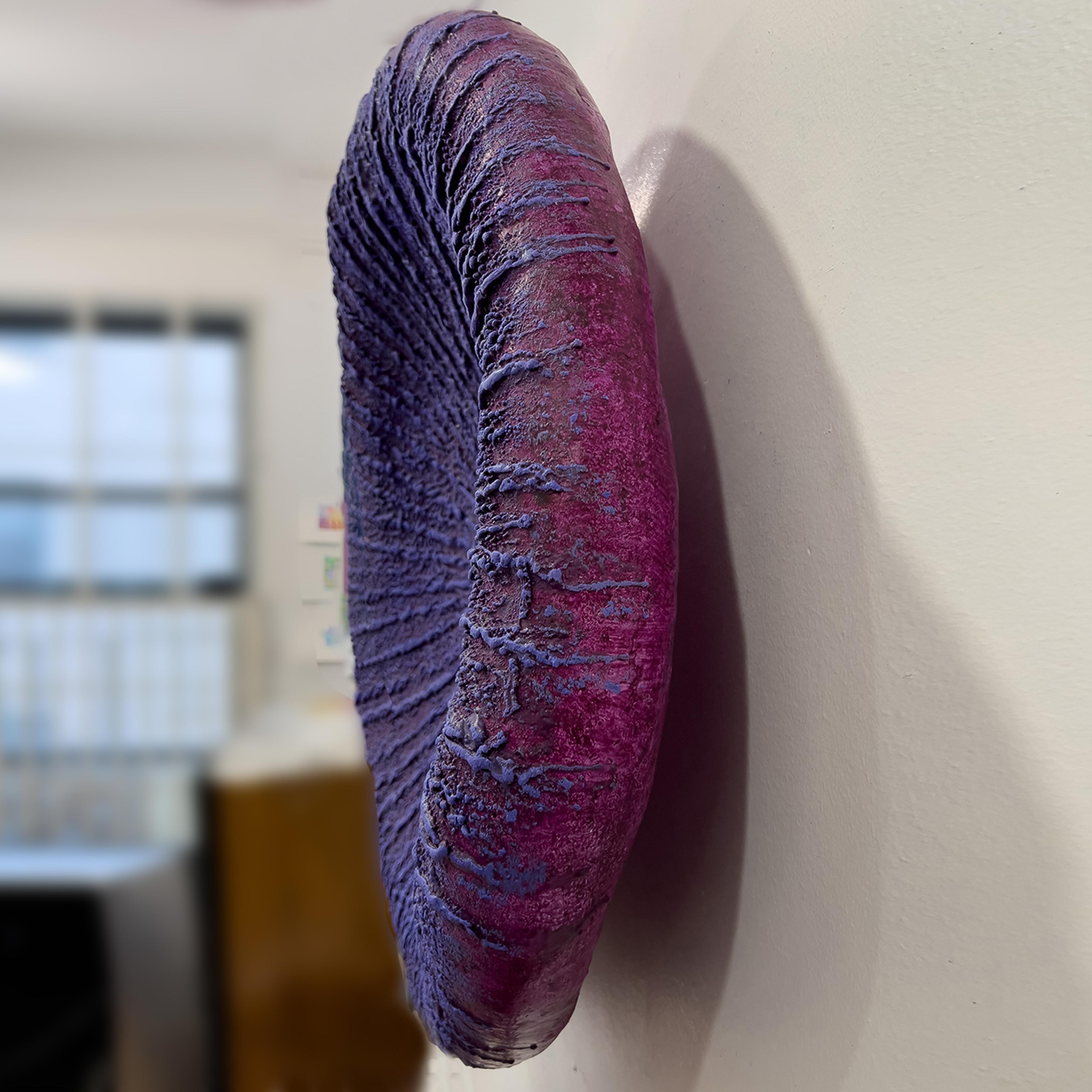 This minimalist purple 3D wall piece is by Barry Katz. He creates pieces that allude to the artist looking into a mirror. And in particular, one which reflects inner states. Not a mirror that flatters, far from, but one that tells inescapable
