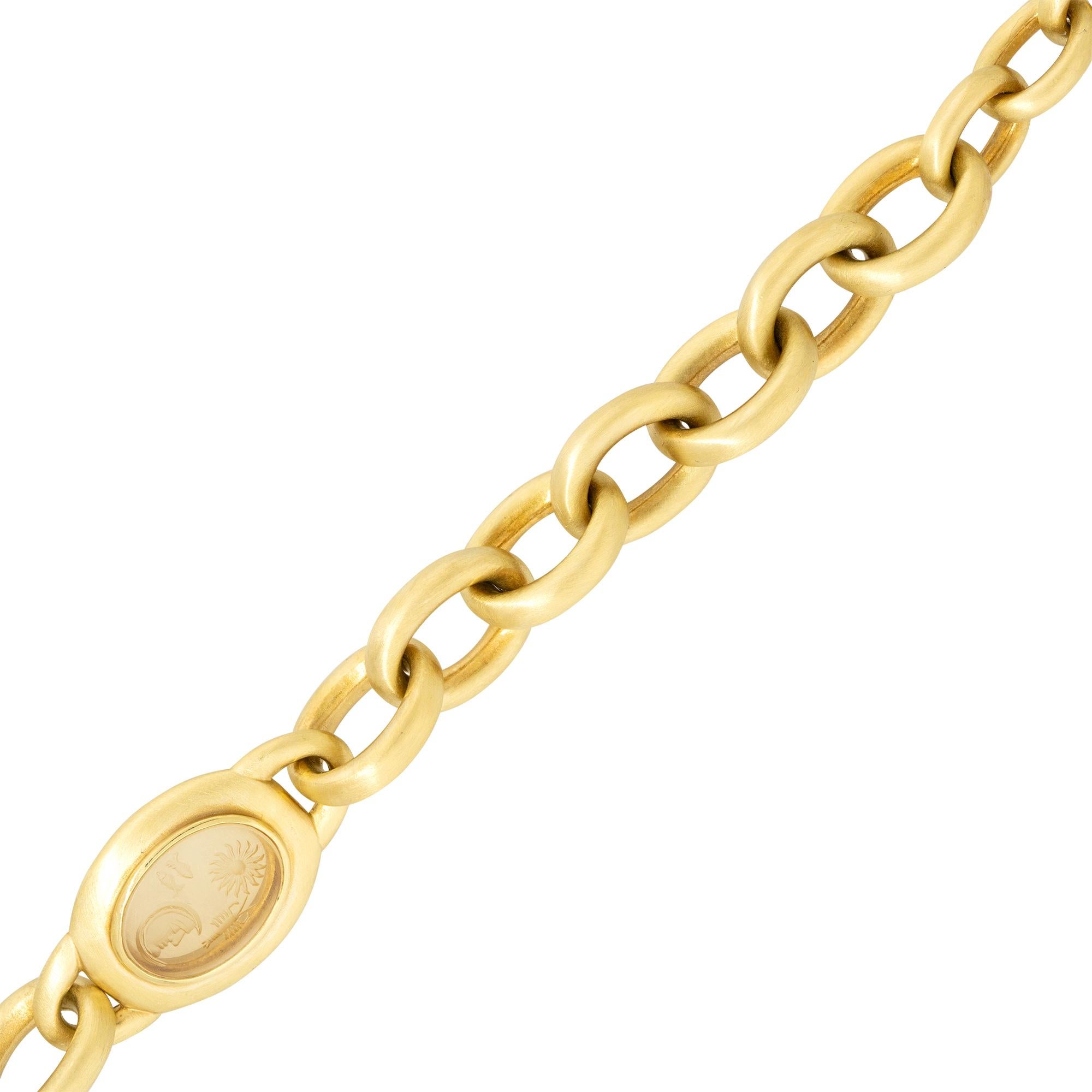 This unique and large solid link bracelet is perfect for anyone looking to make a statement. This bracelet truly stands out thanks to its carved crystal station and diamond set toggle clasp. 

Barry Kieselstein 18 Karat Yellow Gold 0.60 Carat