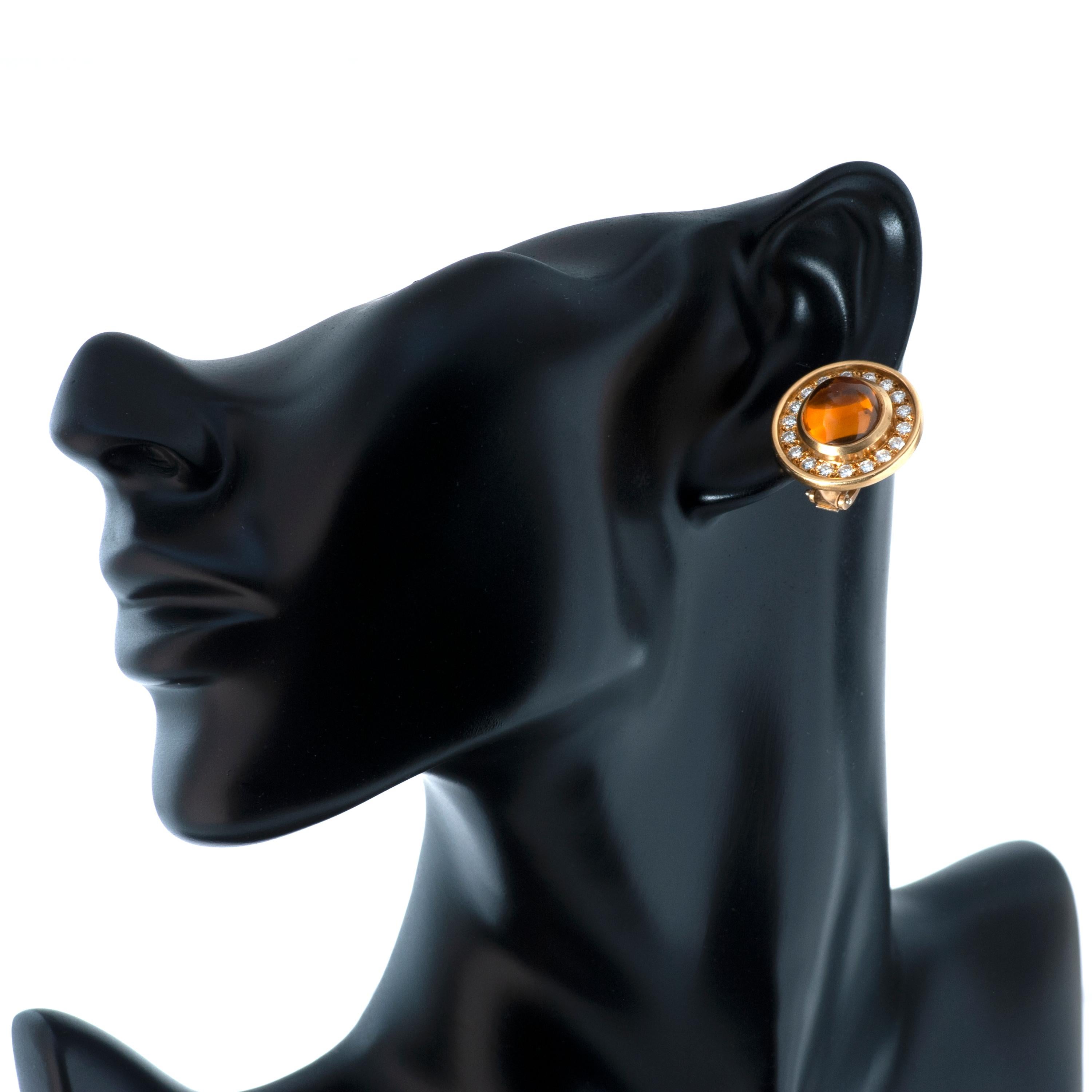 Barry Kieselstein-Cord 18k yellow gold diamond and citrine clip-on earrings.

These earrings feature 2 cabochon citrines weighing an approximate total of 5.20 carats, surrounded by 36 round brilliant cut diamonds totaling approximately 1.26 carats. 