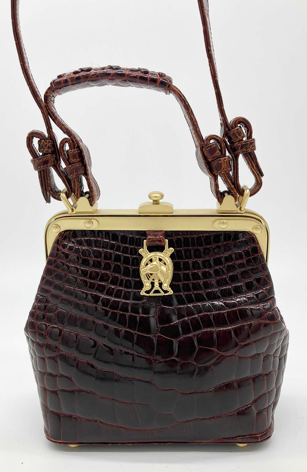 Barry Kieselstein Cord Brown Alligator Horseshoe Handbag in excellent condition. Brown alligator exterior trimmed with matte gold hardware and removable matching alligator shoulder strap. Button hinge closure opens to a green suede interior with two