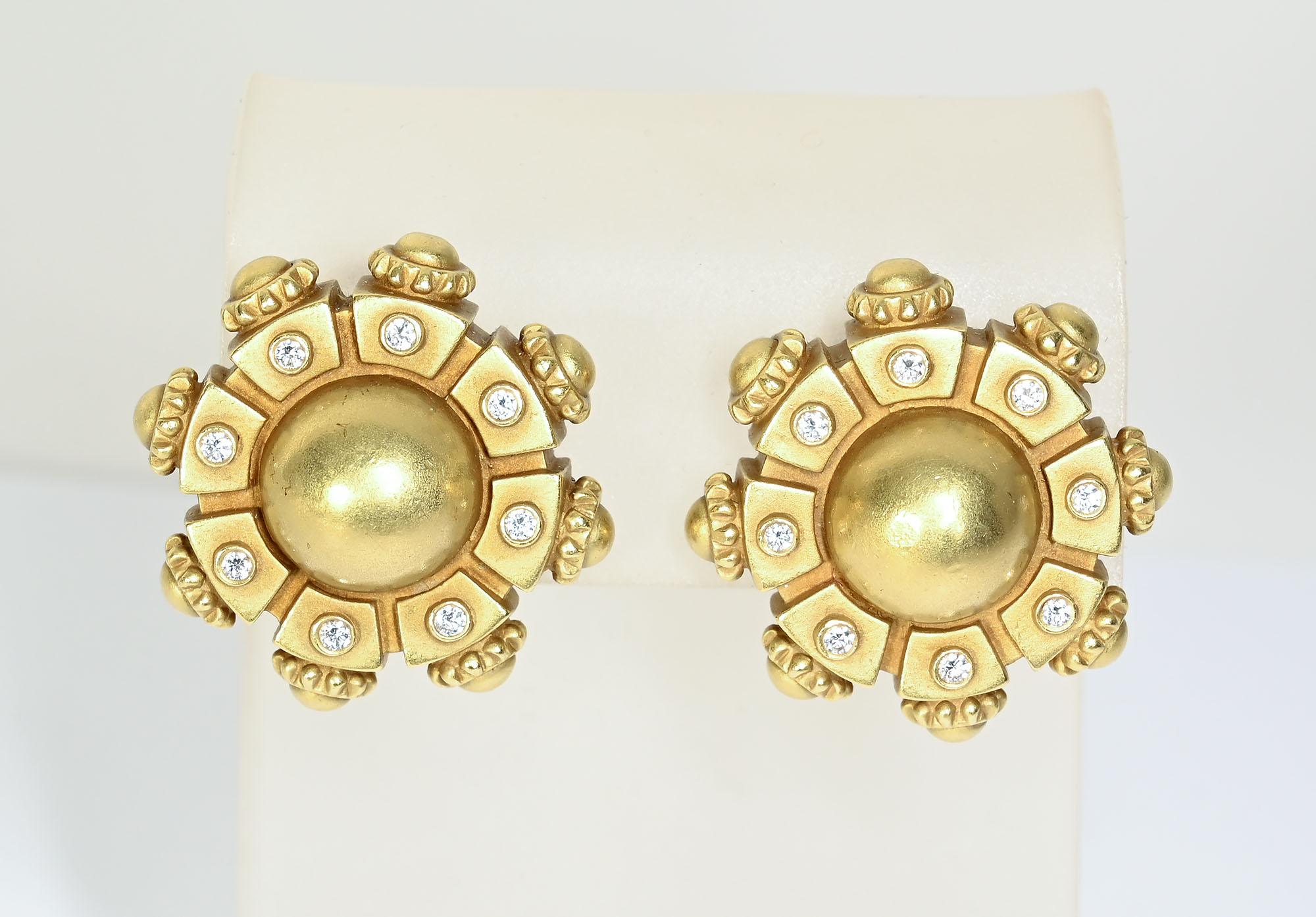 Rare pair of gold and diamonds earrings by Barry Kieselstein Cord. The earrings have a domed round center surrounded by 8 rectangular plaques, each centered with a diamond. The outside of the plaques echoes the center dome with  tiny half circles as