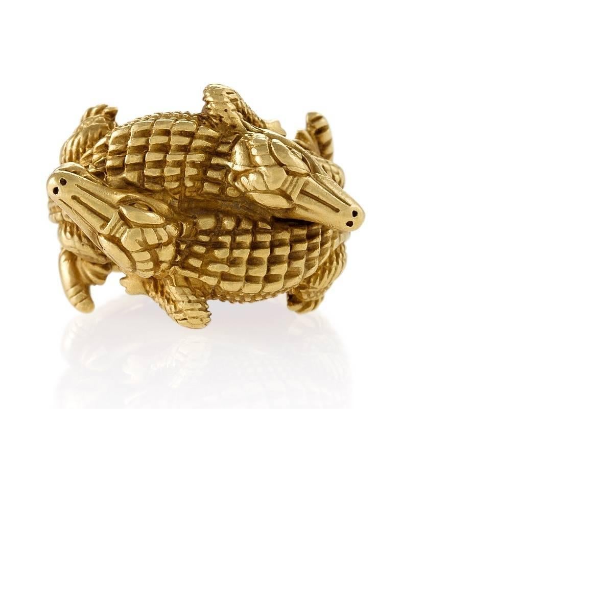 An American Estate 18 karat gold ring by Barry Kieselstein-Cord. The heavily detailed ring is designed in his iconic alligator motif. This particular ring with the double alligators is extremely rare. Circa 2000.

Signed, 