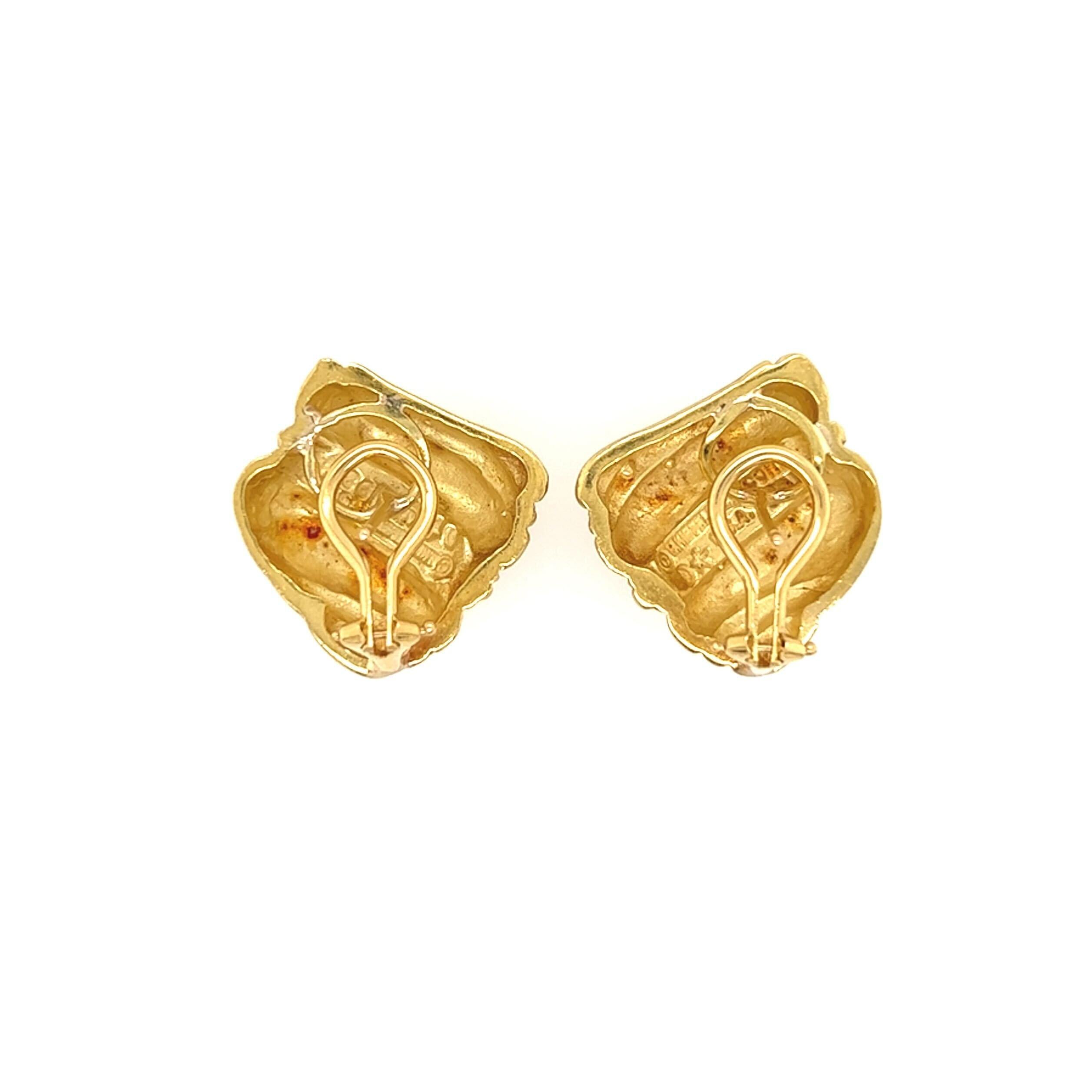 A pair of 18 karat green gold earrings, Barry Kieselstein-Cord.  The “Caviar” earrings designed as swirls centering a row of gold beadwork.  Width approximately 7/8 inch.  Gross weight approximately 17.70 grams.  Signed Kieselstein Cord.
