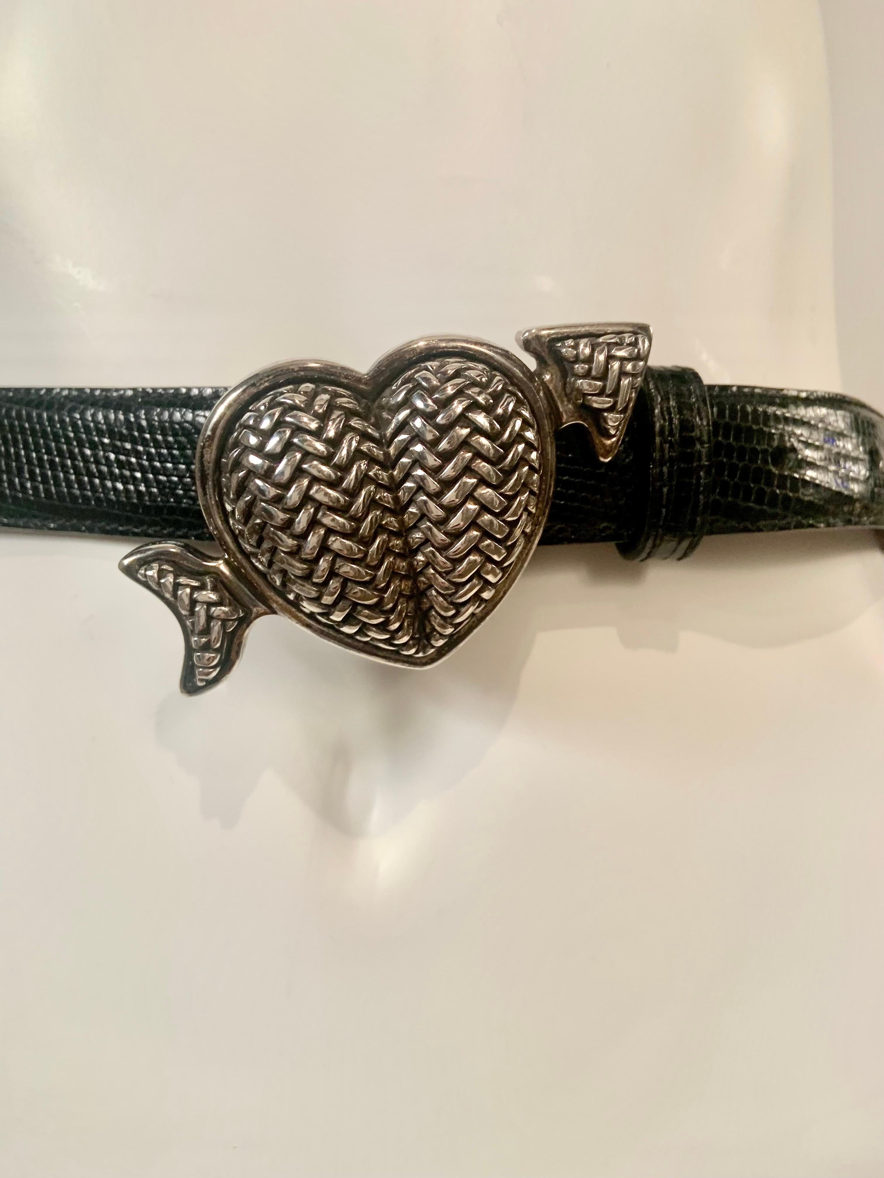 This sterling silver buckle, a heart pierced through by Cupid's Arrow, is perfect for all you romantics, and would be romantics.   The buckle is fully marked on the back, and the black lizard belt is stamped Barry Kieselstein-Cord New York in gold