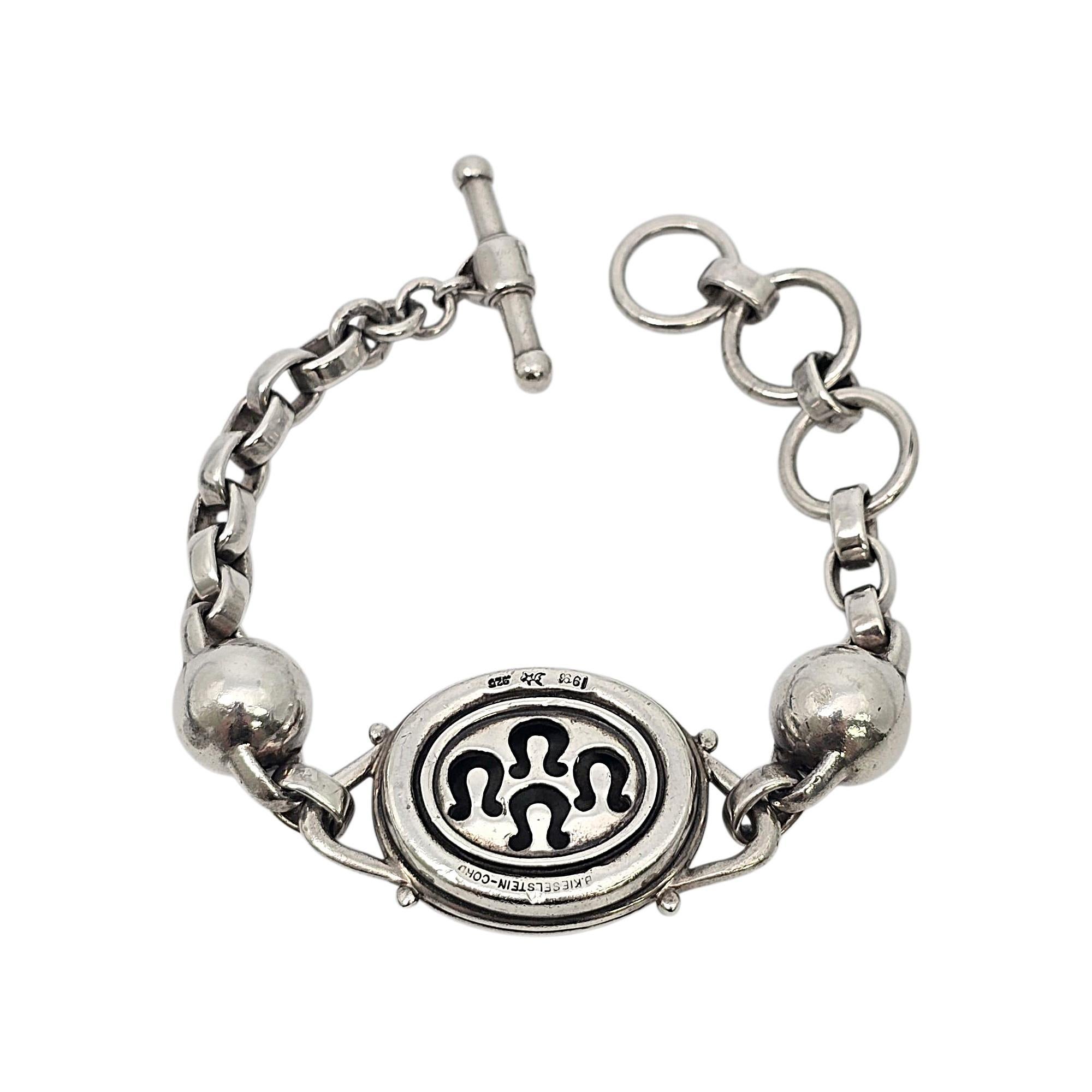 Vintage sterling silver equestrian horse toggle bracelet by Barry Kiselstein-Cord, circa 1996.

This beautiful sterling silver bracelet, by iconic designer Barry Kiselstein-Cord, features a large puffy oval horse medallion, 2 large silver round