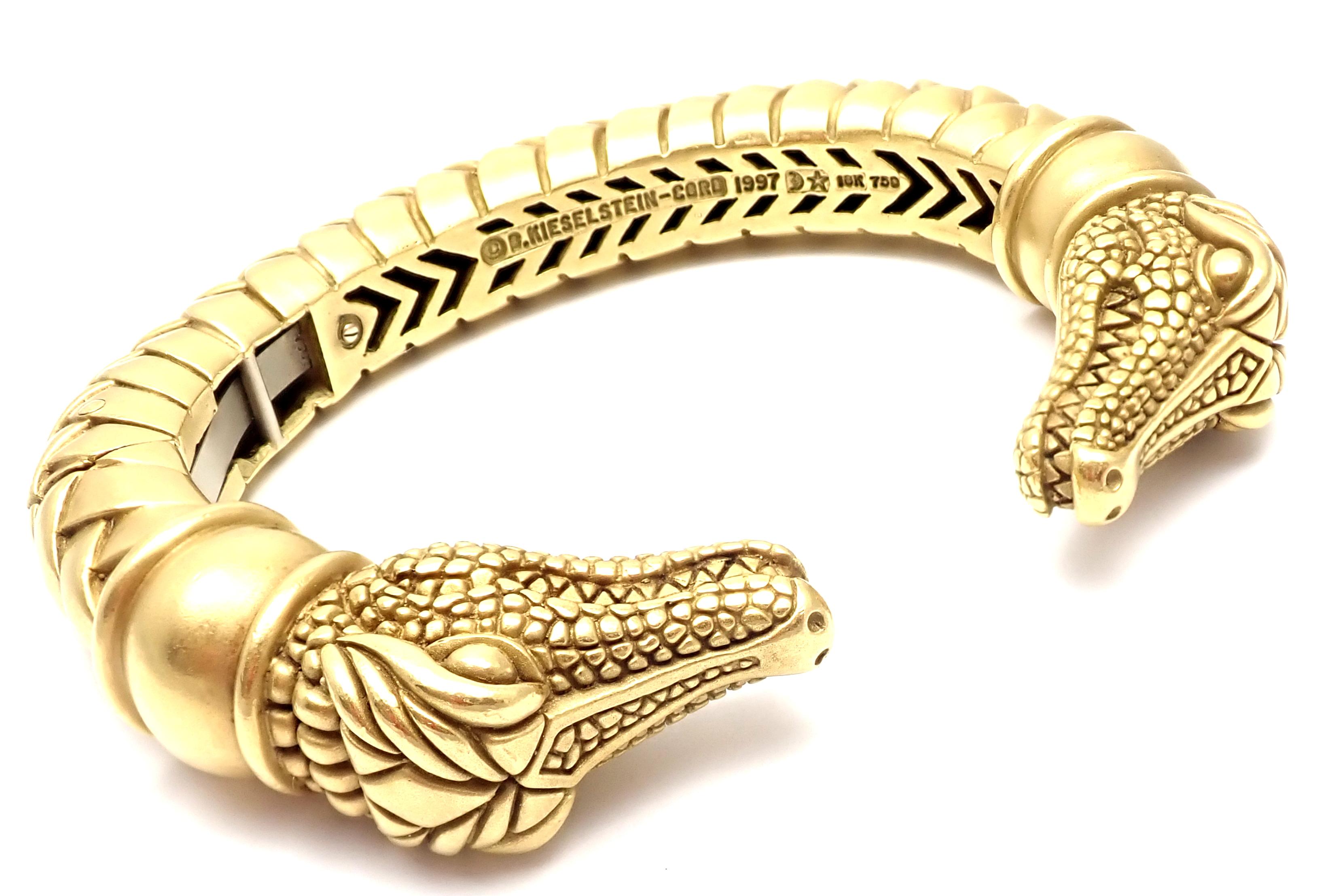 18k Yellow Gold Two Alligator Heads Cuff Bangle Bracelet by Barry Kieselstein Cord.
Details: 
Weight: 141.2 grams
Length: 7.5