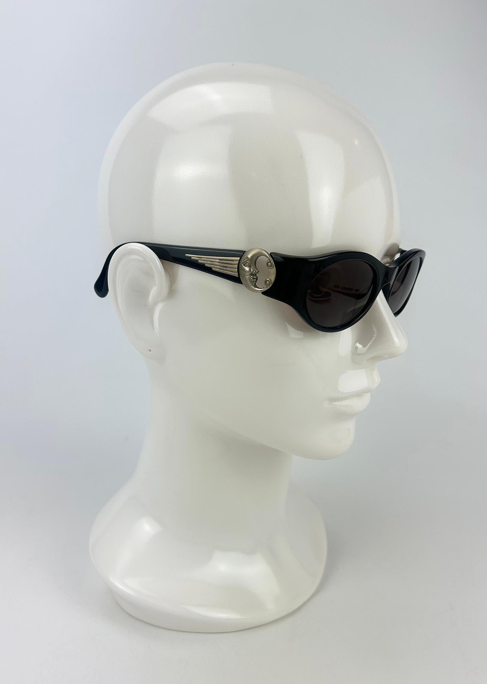 Barry Kieselstein Cord Vintage Black Moon Charm Sunglasses in excellent condition. Black acrylic body with black lenses trimmed with matte silver hardware upon each arm. Unique Moon charm detail on each arm attaching arms to lens front. Overall