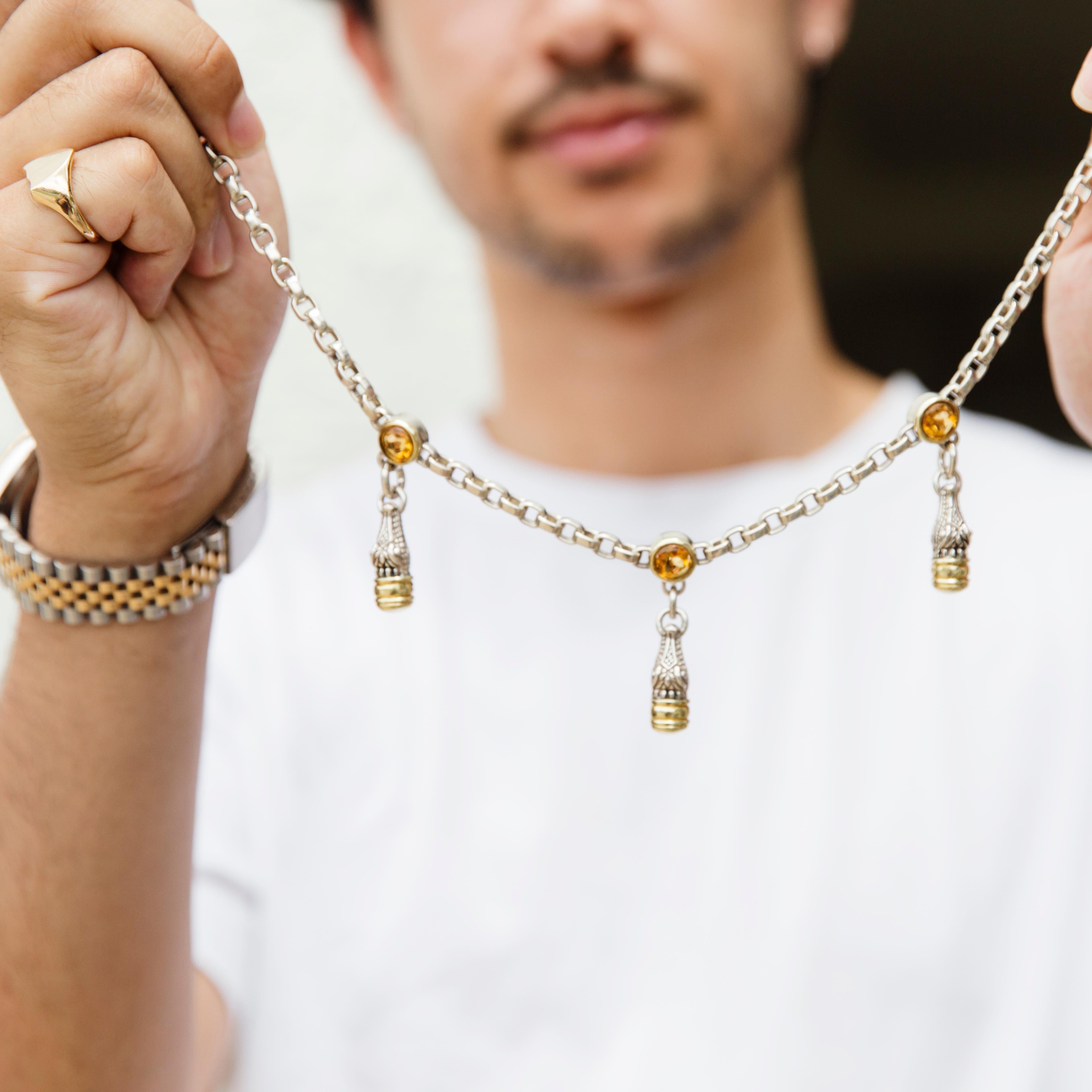 Forged in sterling silver and 14 carat yellow gold, this unique and genuine Barry Kieslestein toggle necklace features three silver and 14 carat yellow gold Alligator heads, along the length of the sterling silver chain, and hang from three