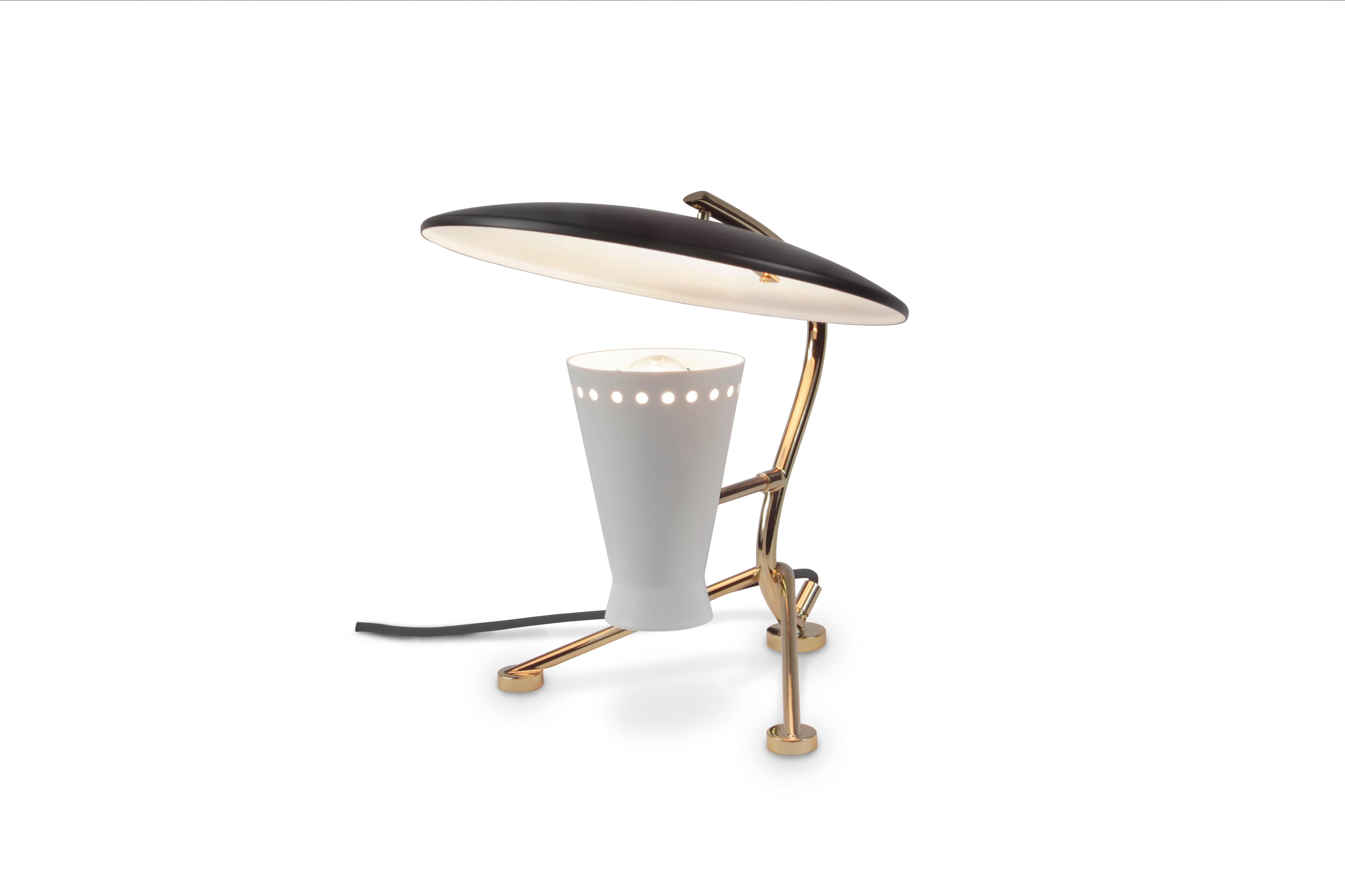 Representing everything that a tripod table lamp should be, Barry mid-century desk lamp is a handmade piece produced in Portugal by some of the finest artisans in the business. This brass lighting design features a shade and a top cover made of