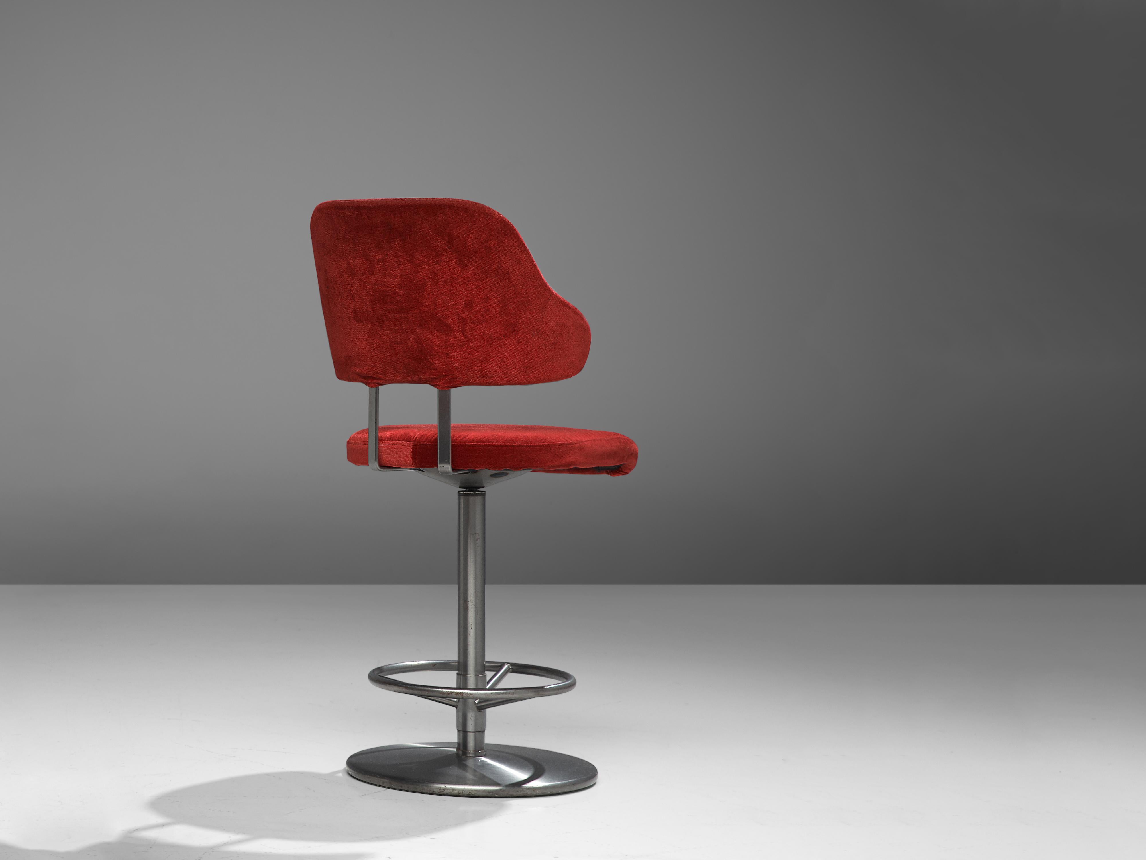 Barstool, metal, velvet upholstery, Europe, 1970s

This barstool is currently upholstered in eye-catching red velvet. A comfortable seat and curved backrest have an inviting look. The round base includes a footrest.

Please note that we advise