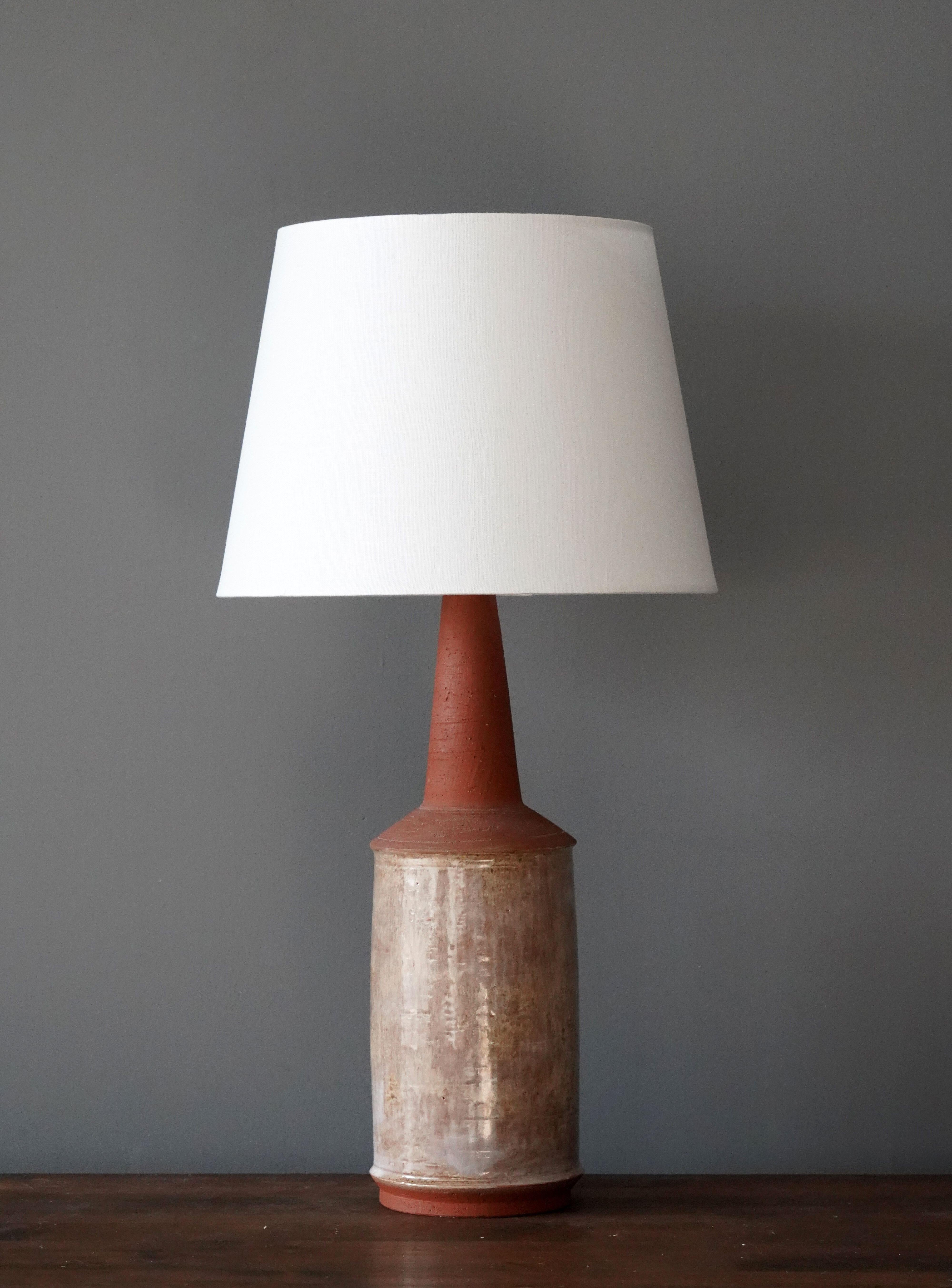 A table lamp produced and design by Bartholdy, Denmark, 1960s. Hand signed.

Lampshade is attached for reference and are not included in the purchase. Measured without lampshade.

Other ceramicists of the period include Axel Salto, Arne Bang,