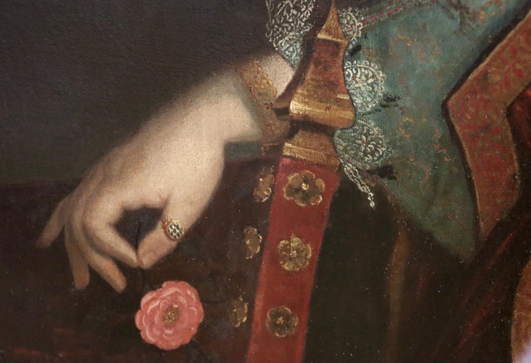 Rare late 16th century Spanish Old Master portrait of a young lady

This fine, life-sized portrait depicts a young lady holding a red flower. She is wearing an elaborate and highly luxurious costume which is adorned with some very expensive jewels,
