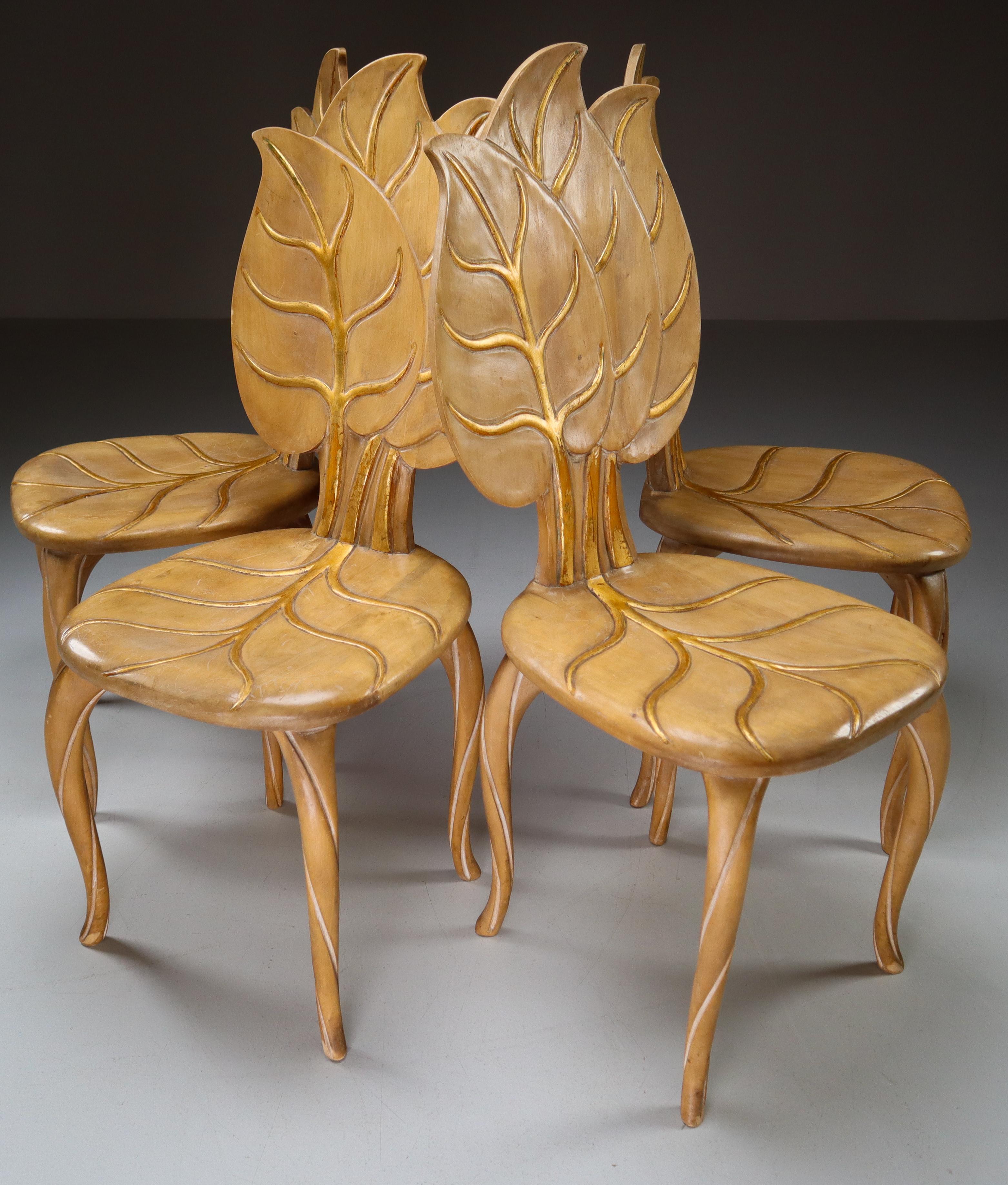 Set of four 1970s Bartolozzi & Maioli hand carved wooden leaf chair with original patina. These chairs would make an eye-catching addition to any interior such as living room, family room, screening room or hotel. It also perfectly fits in a