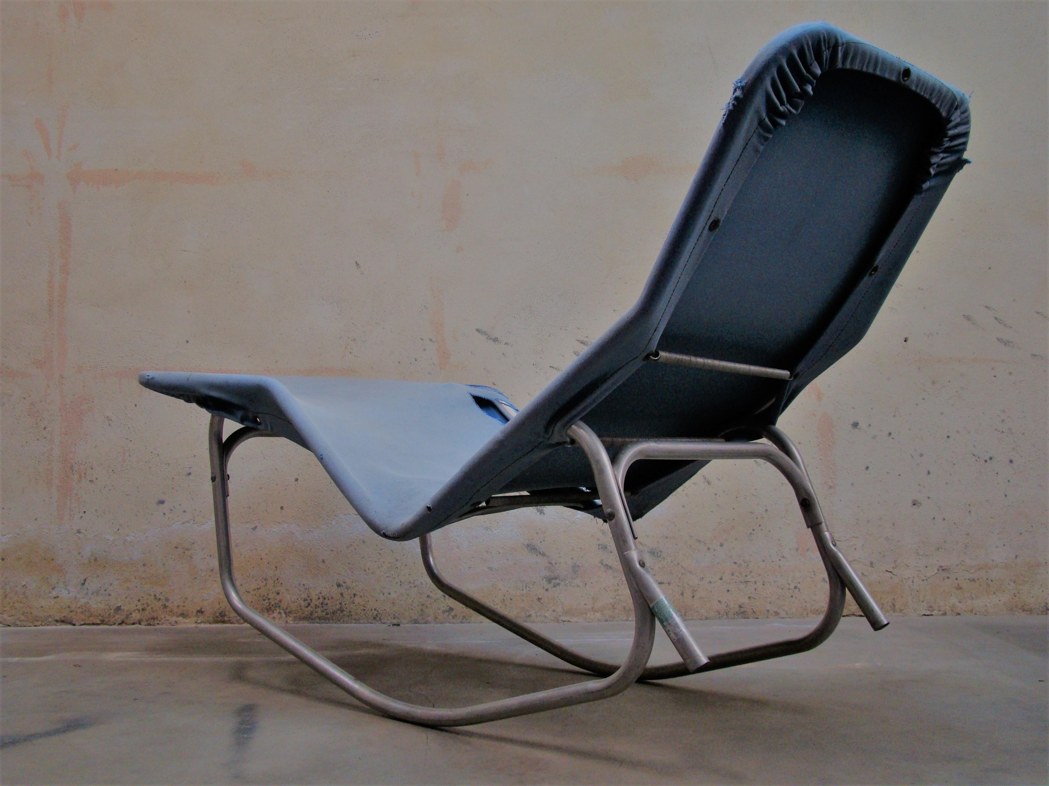 Barwa lounge chairs designed by Edgar Bartolucci and John Waldheim. Made of aluminium extruded tube with a blue canvas sling. The aluminium is weathered from being outside for their lifetime as they were intended, and the canvas is worn.