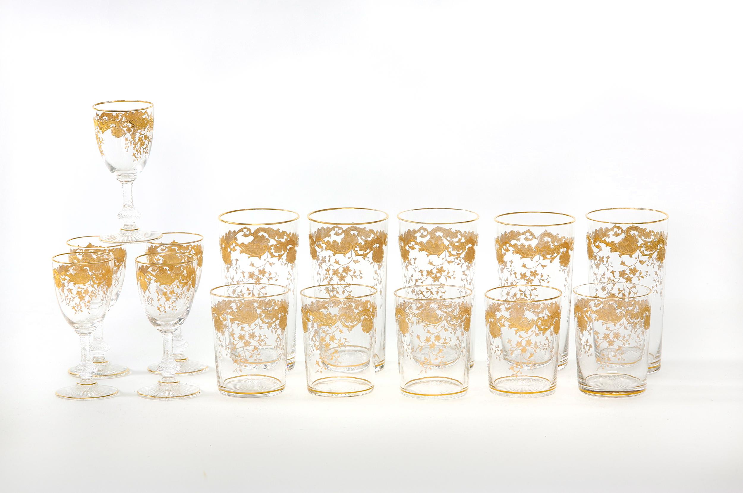 Mid-20th century Saint Louis crystal with gold design details barware / tableware set of 15 pieces. Each piece is in great condition. Maker's mark undersigned. Five high ball glasses 5.5 inches tall x 3 inches diameter five low ball glasses 3.5