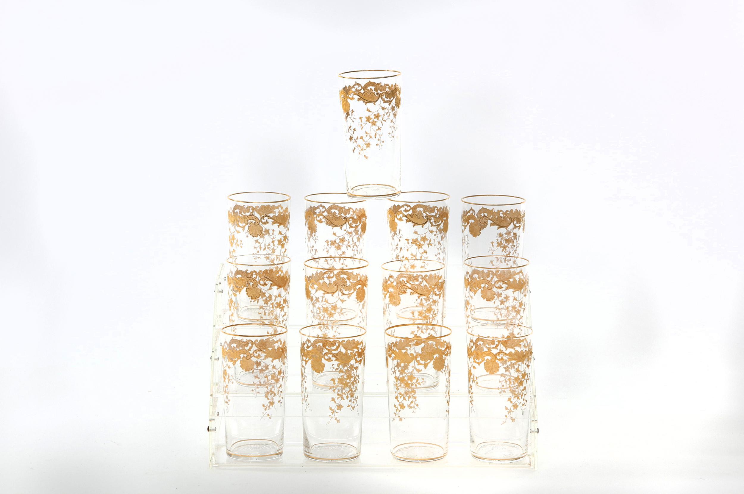 Mid-20th century Saint Louis crystal with gold design details tableware / barware drink service for twelve people. Each one is in great condition. Maker's mark stamped undersigned. Each one stands about 5 inches tall x 2.5 inches diameter.