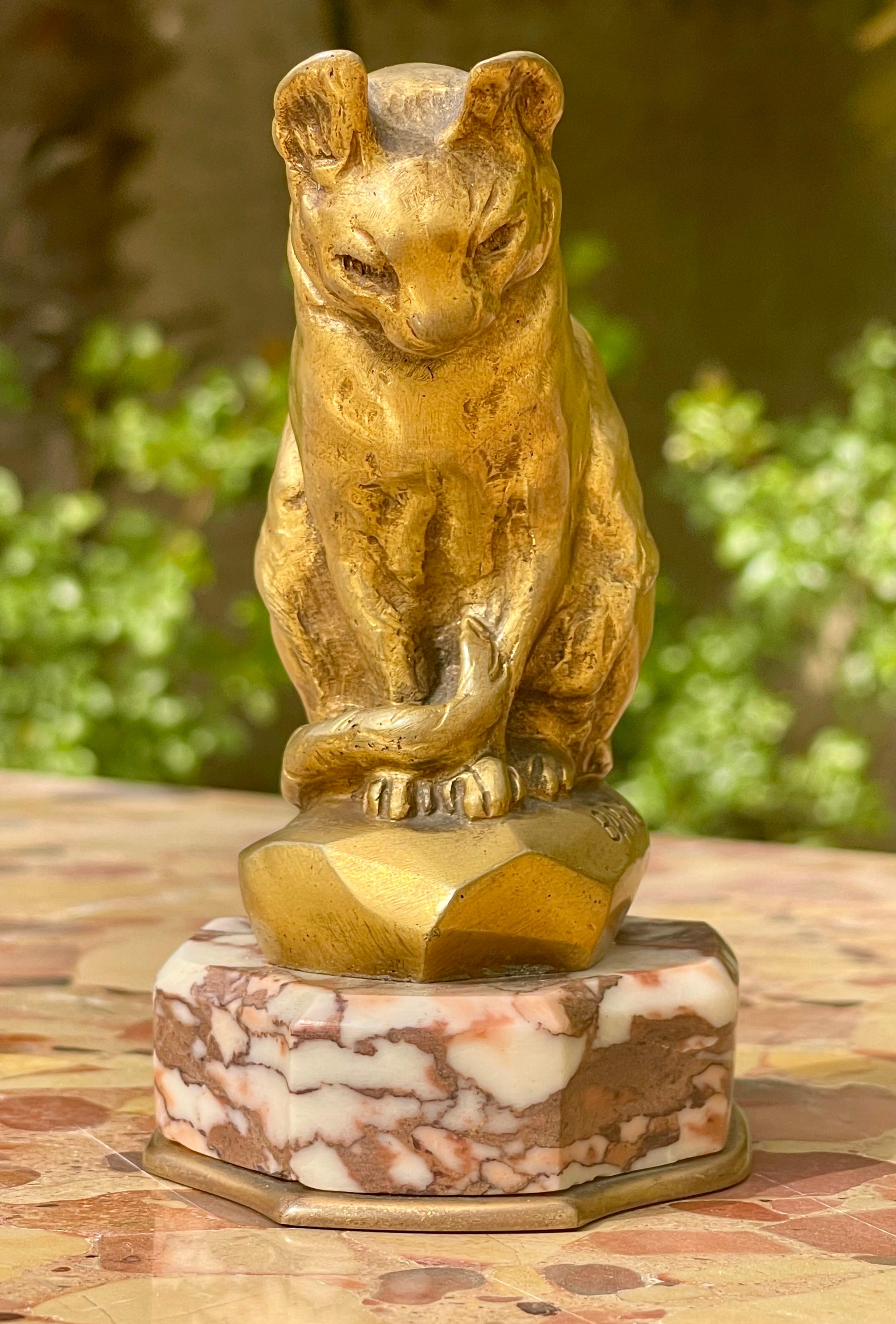Small seated gilt bronze cat signed on the base 
