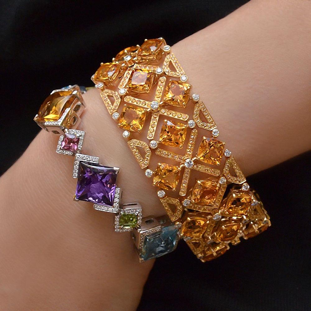 Designed by Barzizza of Valenza, Italy.  Founded in 1958 the firm produces very limited series of unique jewelry pieces.
This 18 karat white gold bracelet is set with six large square cut stones of Citrine,Yellow Quartz,Amethyst, and Blue Topaz. 