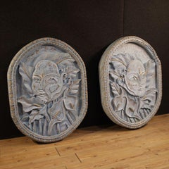 Bas-relief sculpture, stylized face with flowers, 20th century