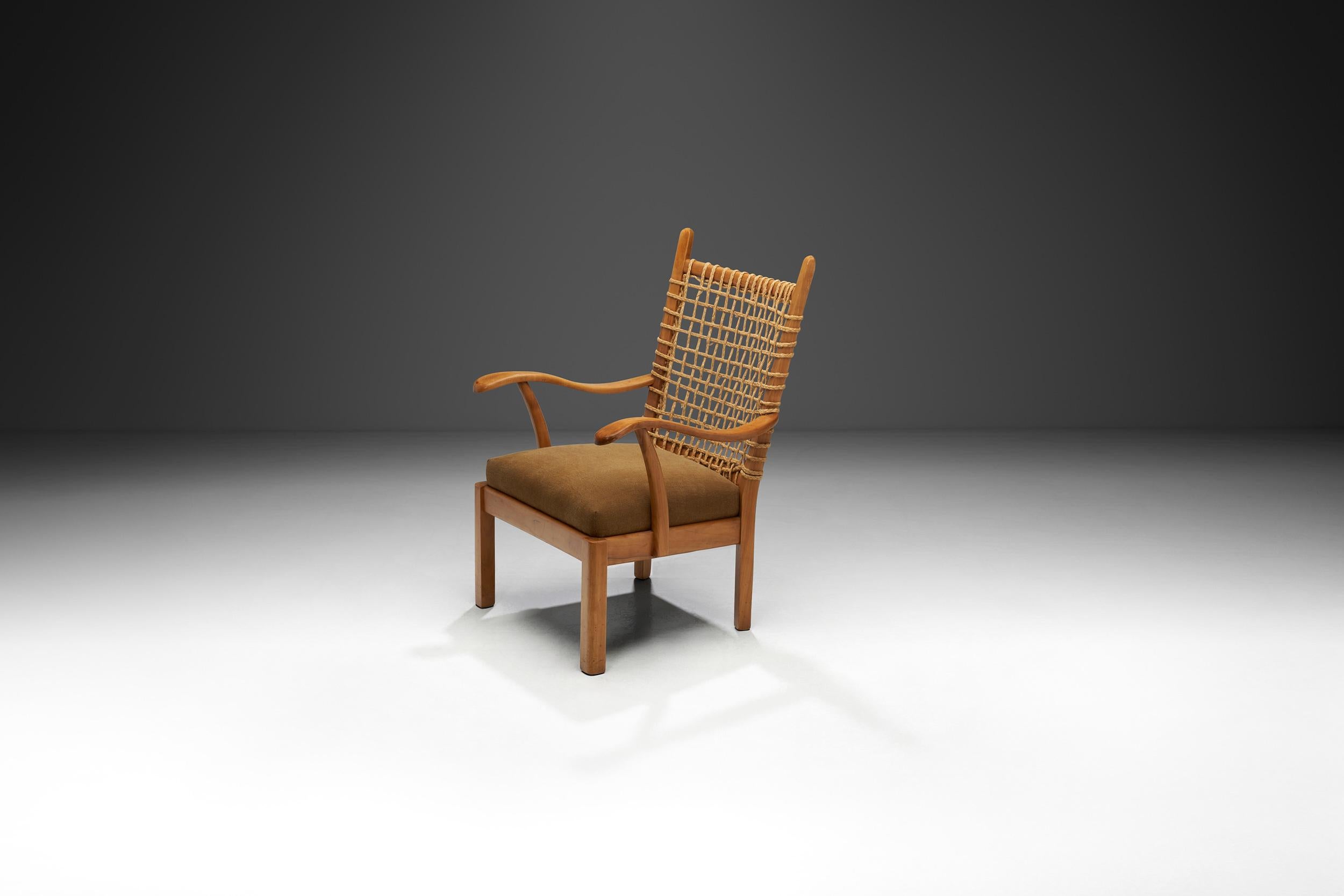 This easy chair in solid wood and wicker by Dutch designer, Bas Van Pelt, is a rare model with plenty of visual delights. The construction of this design is simple at its core, but thanks to its details, it is a playful representation of early Dutch