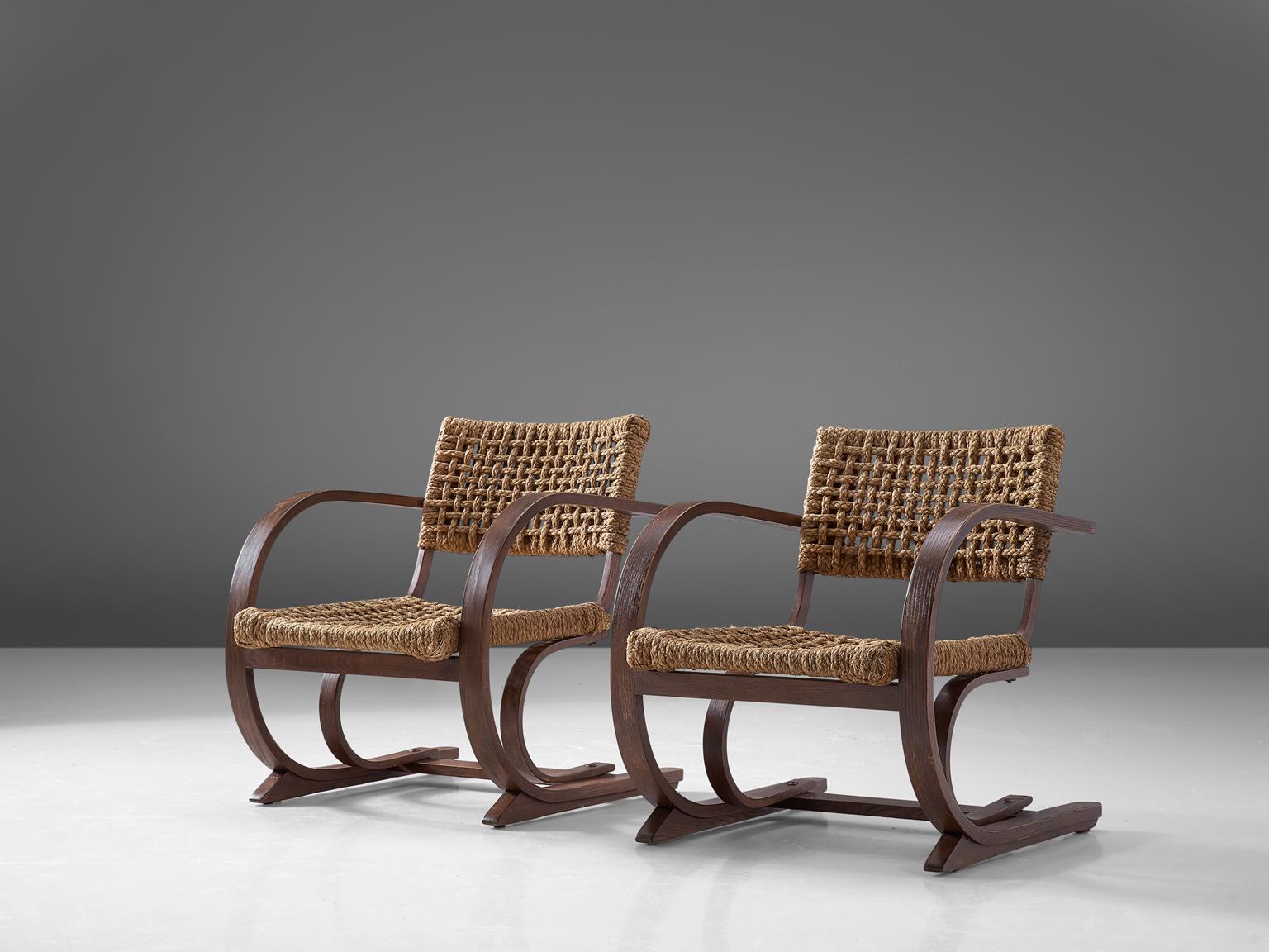 Bas Van Pelt, set of two armchairs, oak and rope, the Netherlands, late 1940s

This armchair was designed by Bas Van Pelt and produced in the Netherlands. The striking curved frame is made of oakwood. The double bentwood curved legs strengthen the