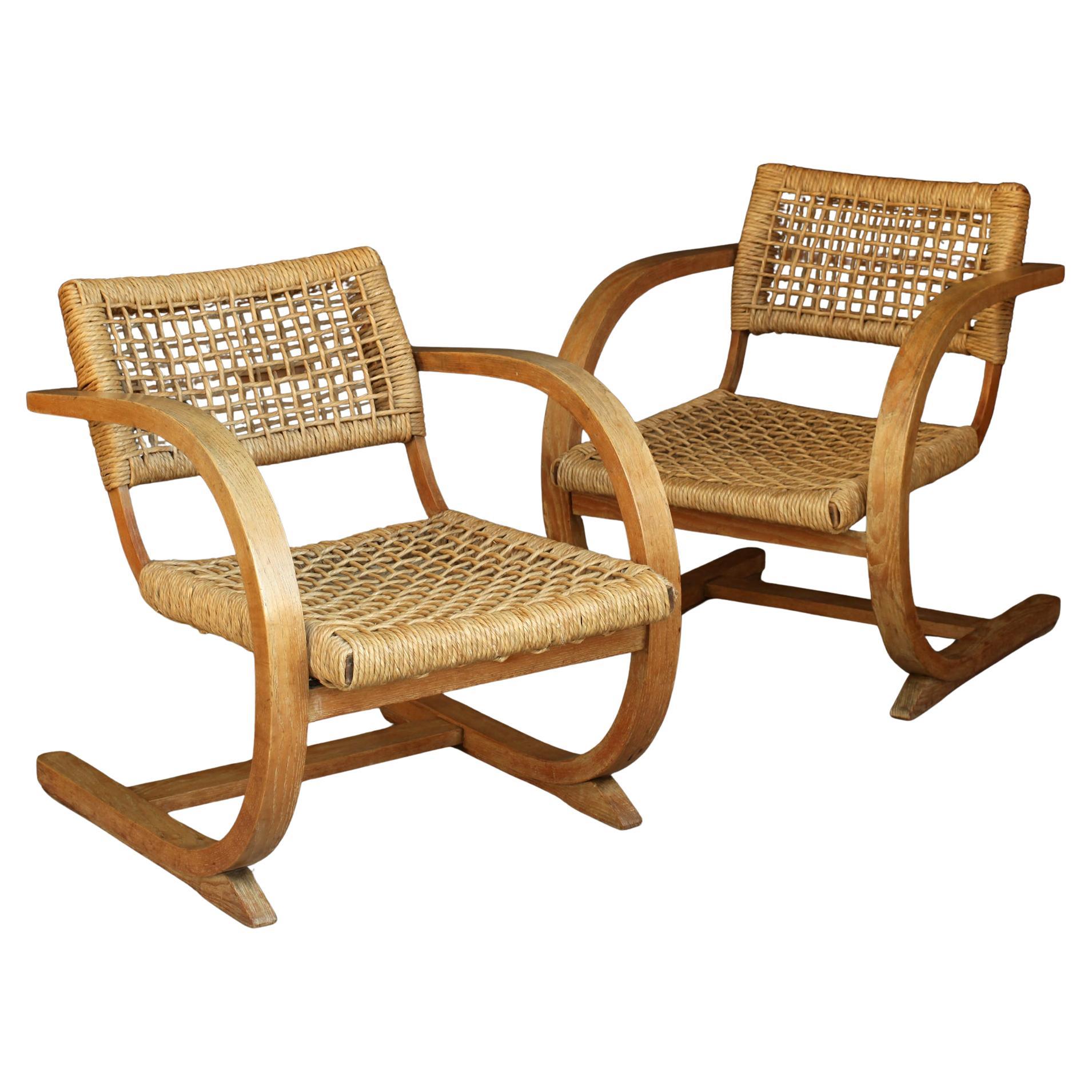 Pair of Bas Van Pelt armchairs from Netherlands 1930s.
A striking design, with clean, airy curves for the oak frame and warm woven straw rope for the seat and backrest.
An example of design from the Amsterdam School and the Dutch Modern Movement