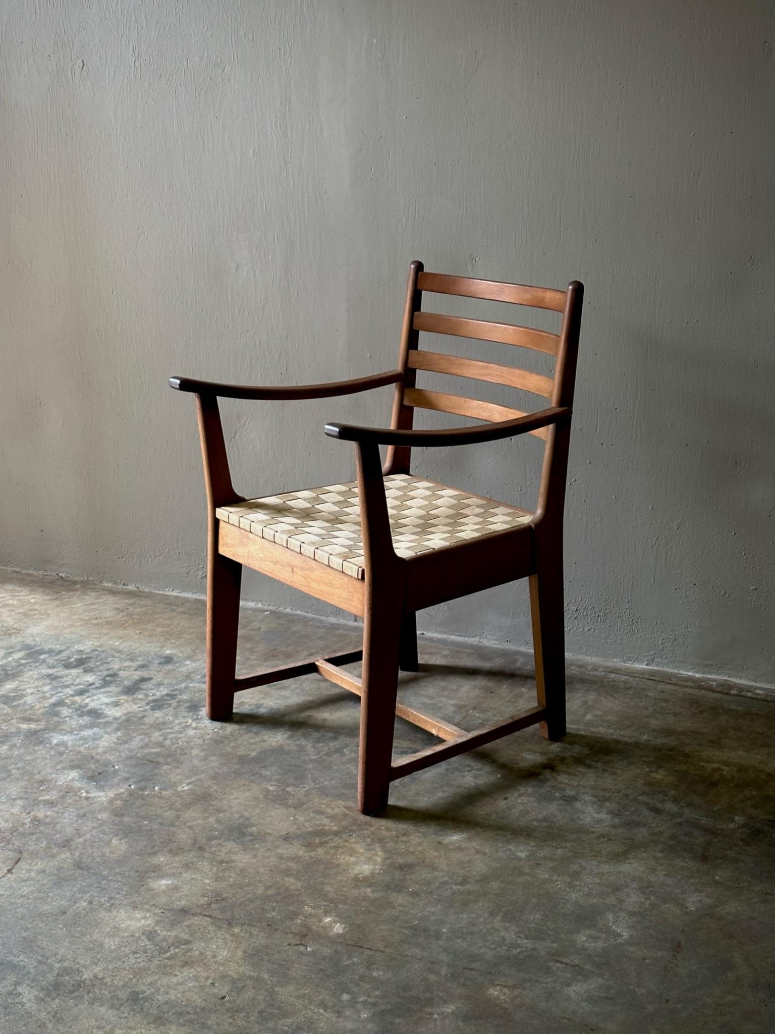 Rare Bas Van Pelt armchair with solid teak framework and beige fabric strap seat cushion. An exceptional work of high Dutch modernism with a relaxed, earthy feel and refined, modern sensibility.

Netherlands, circa 1930

Dimensions: 22.8W x 24.8D x
