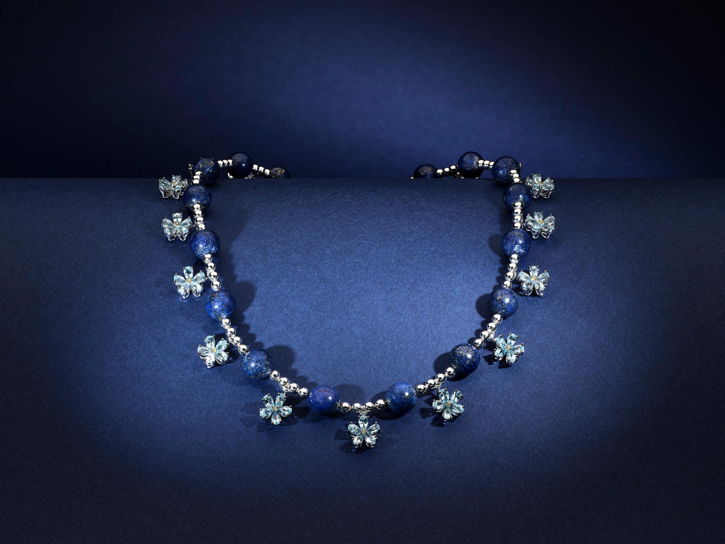 Forget Me Not Necklace is hand made by artisans in Grand Bazaar, using 18 karat white gold, with a total of 14.4ct aquamarine drops, gold and lapis lazuli beads
diamonds on the locking mechanism is diamonds, and the leaf motif of the necklace is a