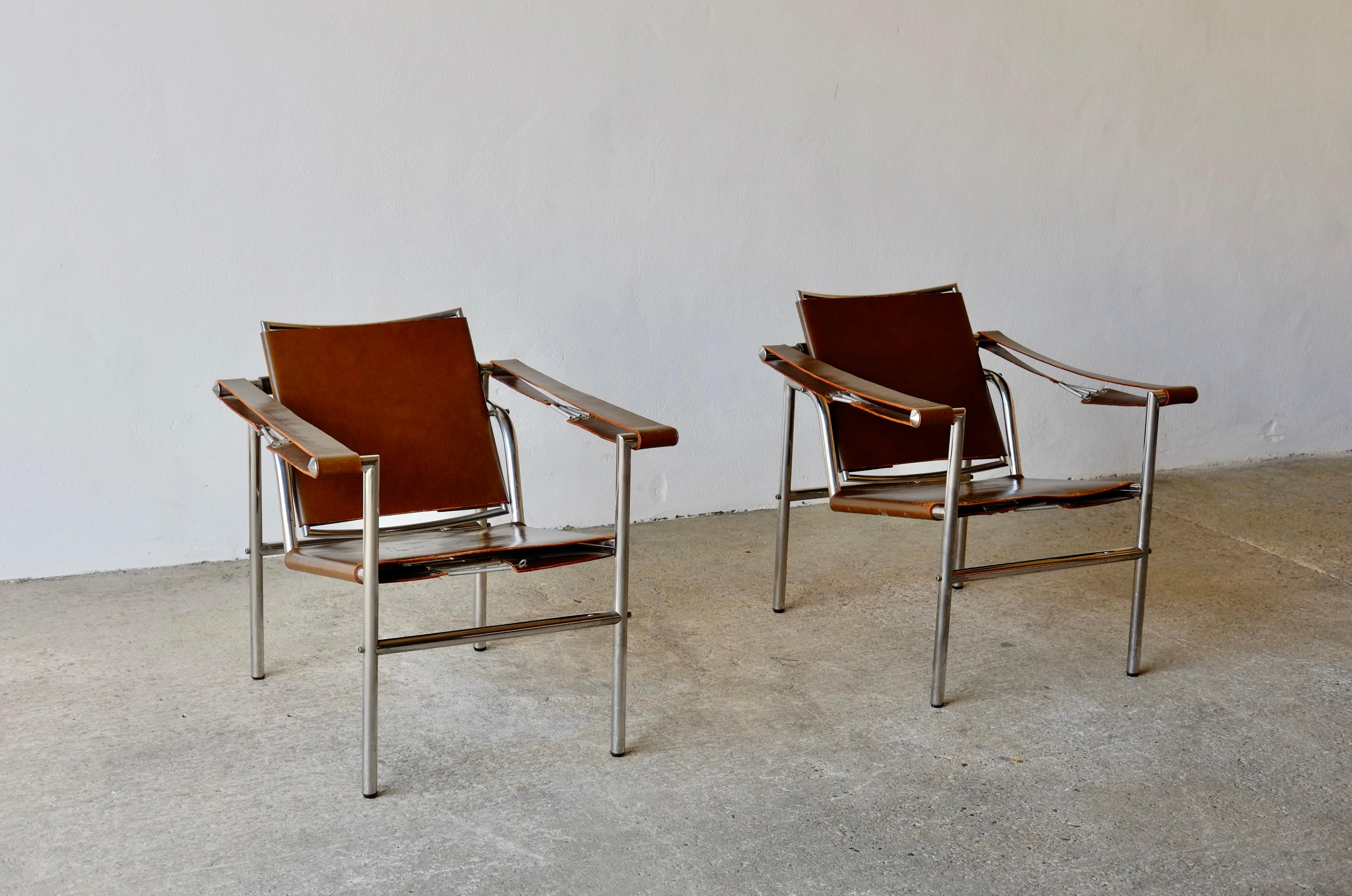 A pair of extremely rare Basculant chairs designed by Le Corbusier. 
Designed in 1928 and featuring the same construction (arresting bars in the back, screwed frame, sprung arm rests) as the original German Thonet B301 production from the 1930's.