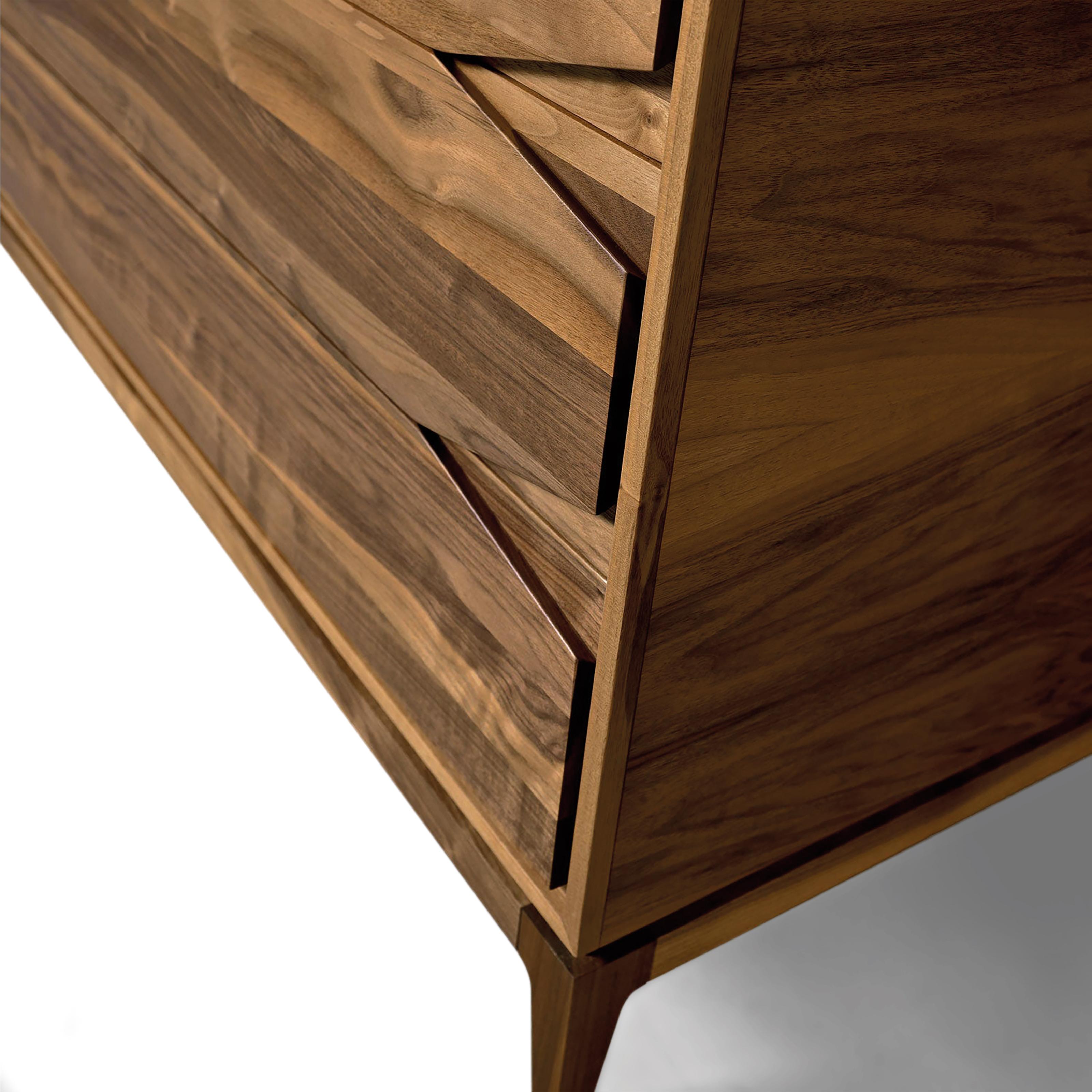 Base Dresser by Dale Italia
Dimensions: D 55 x W 131 x H 80 cm.
Materials: Walnut.

Walnut veneer blockboard and drawers in solid walnut. Available in two different sizes and two finishes: natural and grey walnut. Prices may vary. Please contact